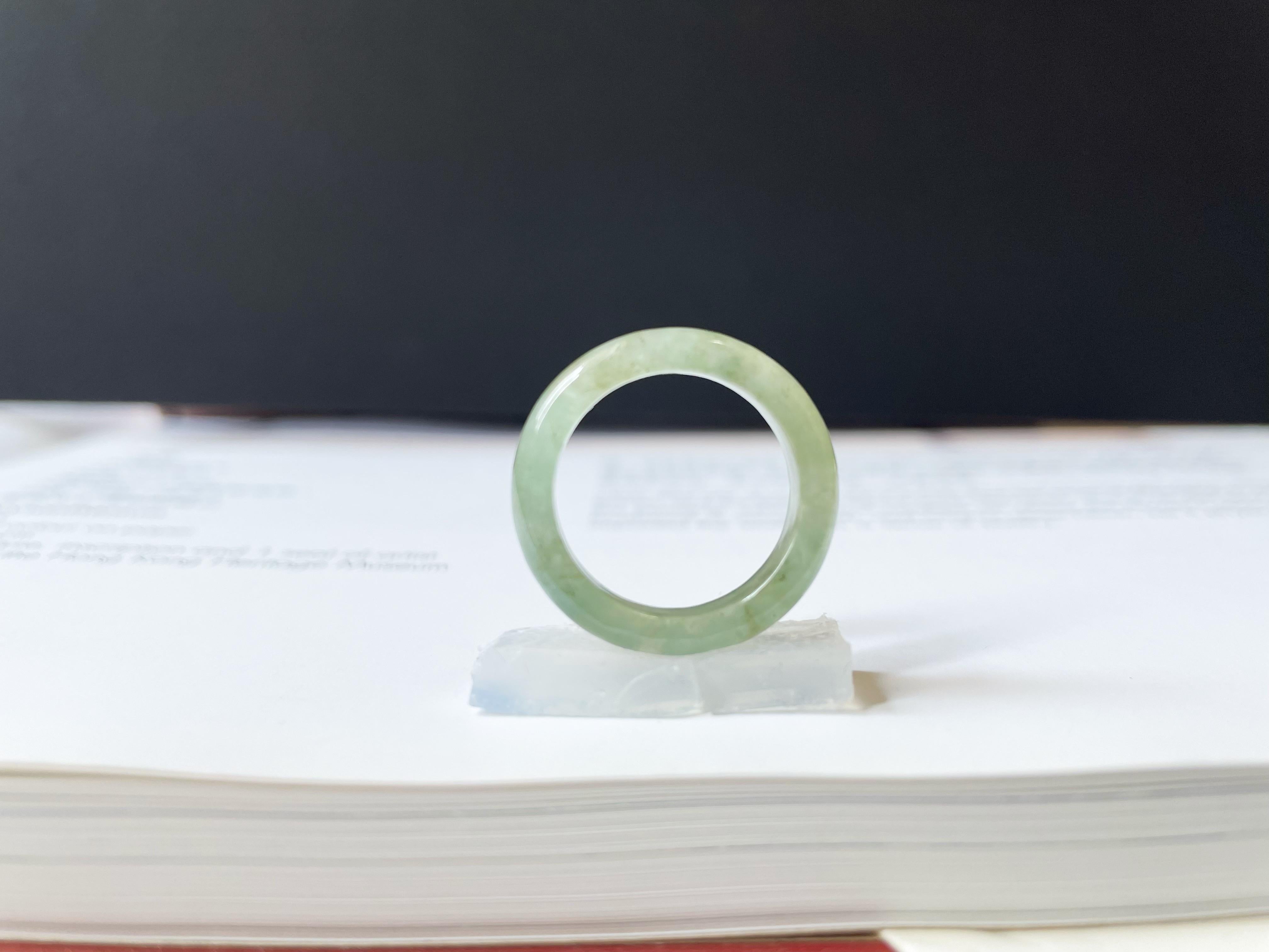 Elevate your jewelry collection with our stunning A-Grade Type A Natural Myanmar Jadeite Band. This exquisite ring is 100% natural, untreated, and undyed, carefully hand-carved to showcase its unique bluish-green hue and vitreous luster. The