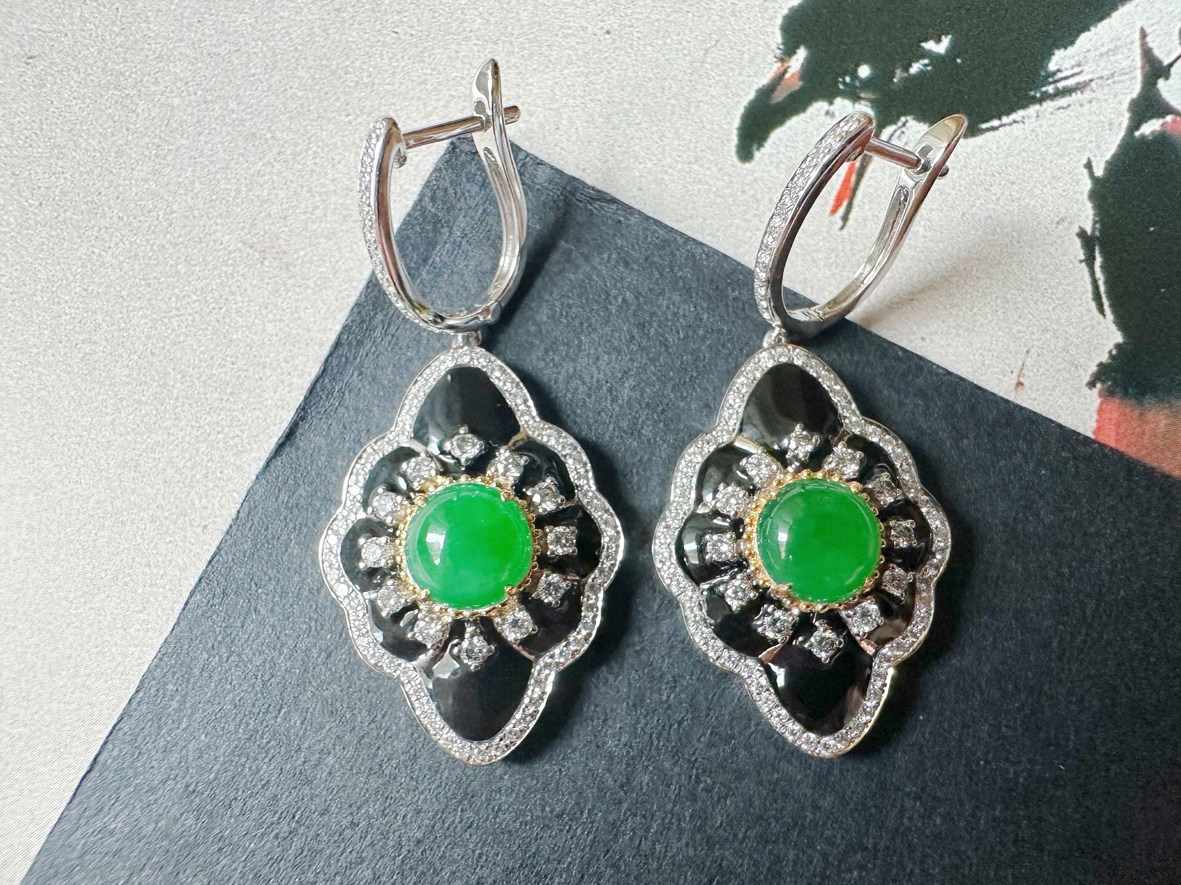 Indulge in the luxurious elegance of these imperial green jade cabochon earrings, beautifully set in 18K gold. The rich green hues of the jade create a striking focal point, enhanced by the sophisticated contrast of black agate and shimmering
