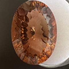 Natürlicher kaiserlicher orangefarbener Topas 21,83 Karat Fancy Oval Concave Cut Edelstein