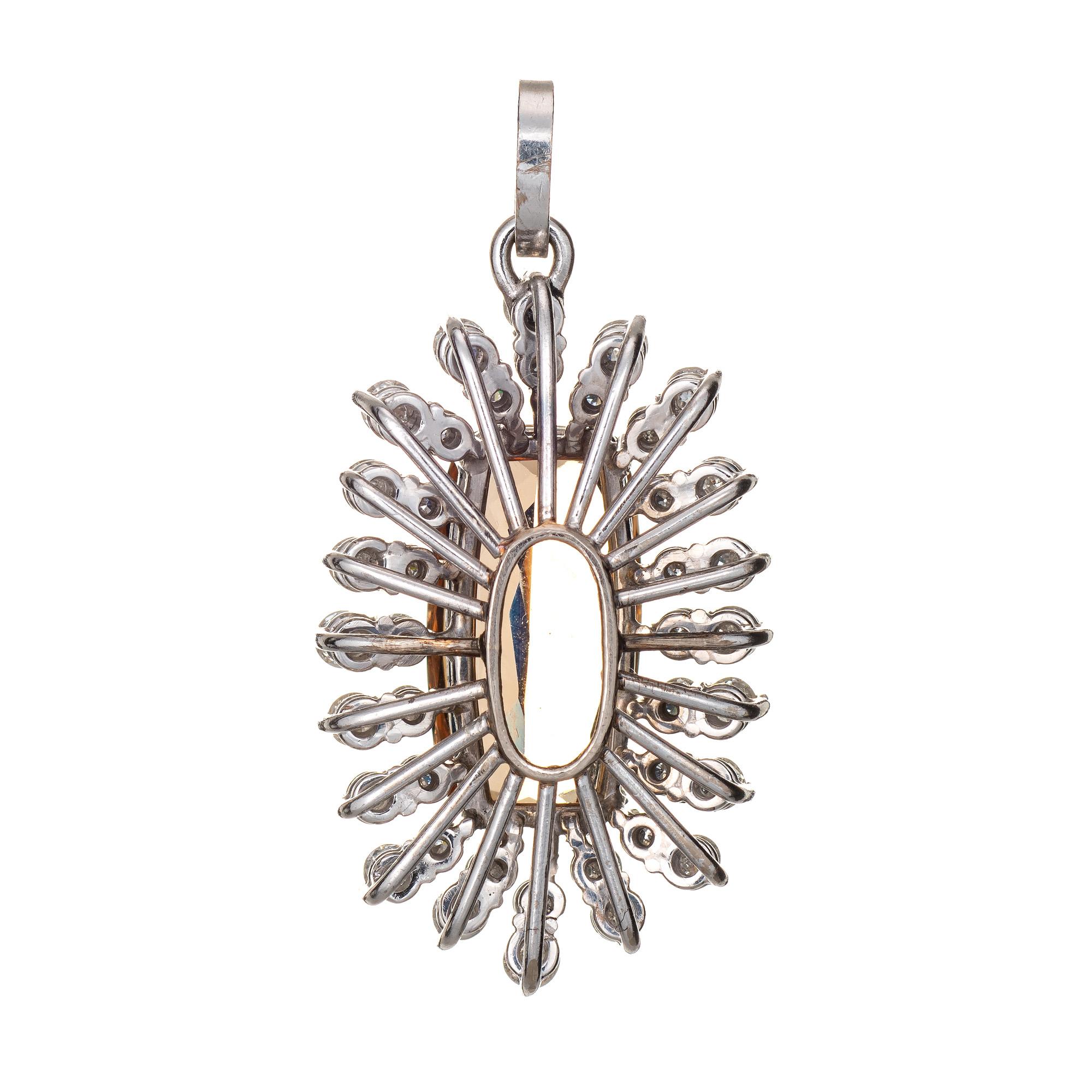 Finely detailed vintage precious natural imperial topaz & diamond pendant crafted in 14k white gold.  

One long cushion shape mixed cut Natural Precious Topaz, approx. 8.25ct (17.80 x 9.52 x 5.76mm), light-medium yellowish-brown color, nearly