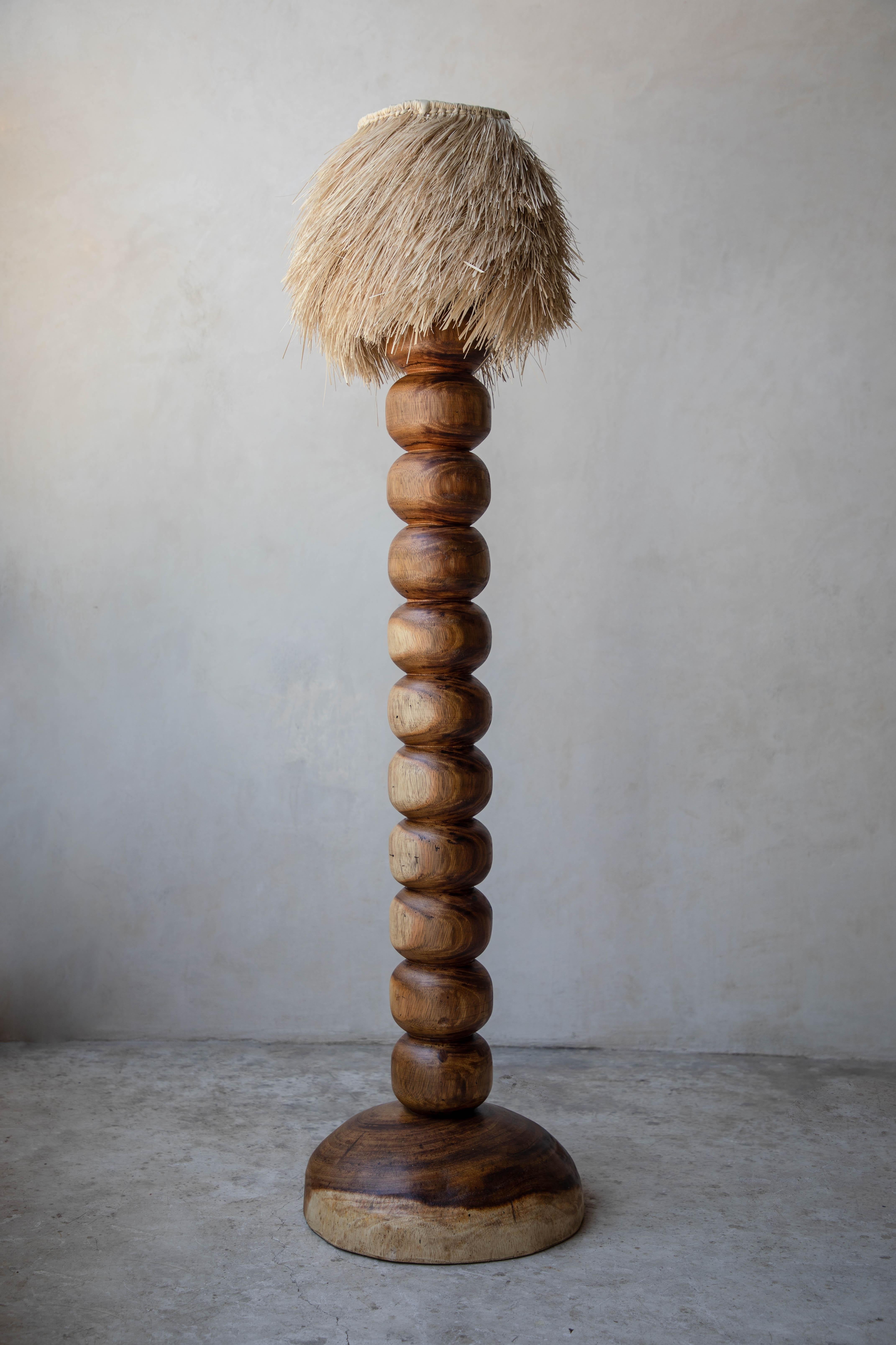 Natural jabin wood floor lamp with palm screen by Daniel Orozco
Material: Jabin wood.
Dimensions: D 39.9 x H 159.8 cm
Available in palm or linen lampshade and in natural or black wood finish.
Available in 2 sizes: D30 x H110, D40 x H160 cm.

Natural
