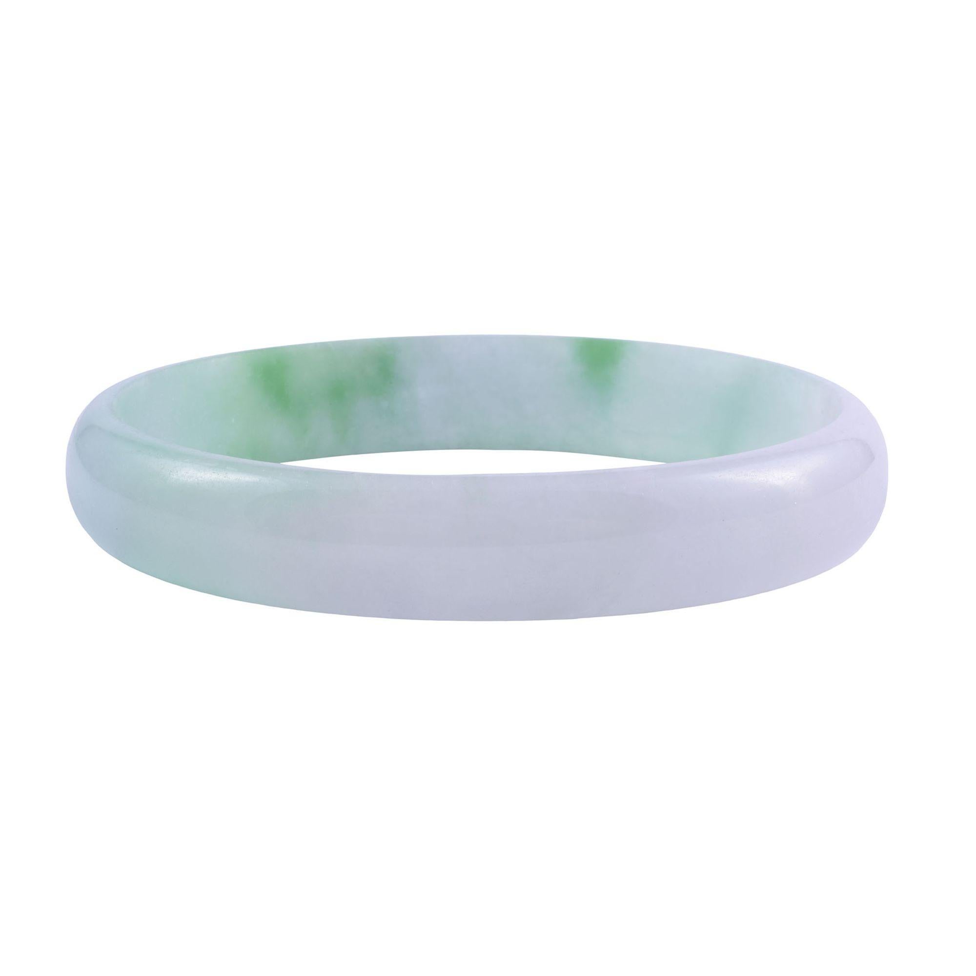 Vintage natural jade bangle bracelet, circa 1960-70. This bangle style bracelet is carved from a solid piece of jade. [MICO A106416 P]
 
Dimensions
6.25″ internal circumference; 60.6mm diameter; 4.7mm W x 9.5mm D