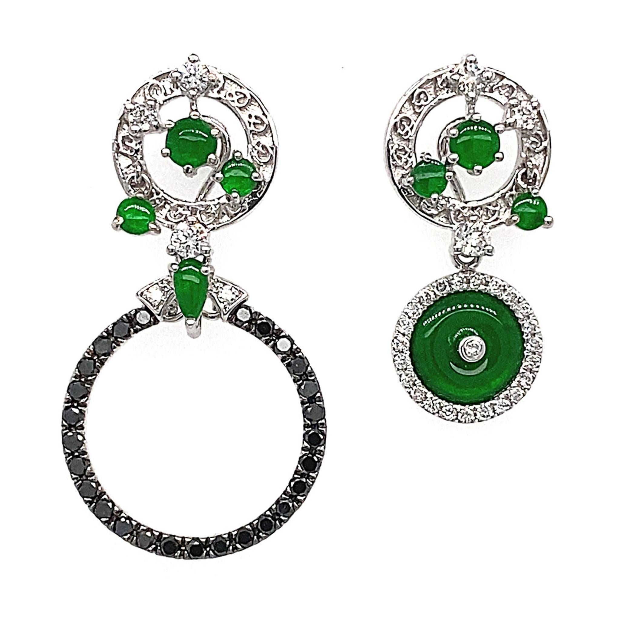 Coveted for her modern interpretation of the gem’s traditional flair, Dilys’ forest-green 'peace buckle' jade drop earrings perfectly capture the designer’s modernist influences. Encircled by 54 Black Round Diamonds totalling 0.63ct and 58 White