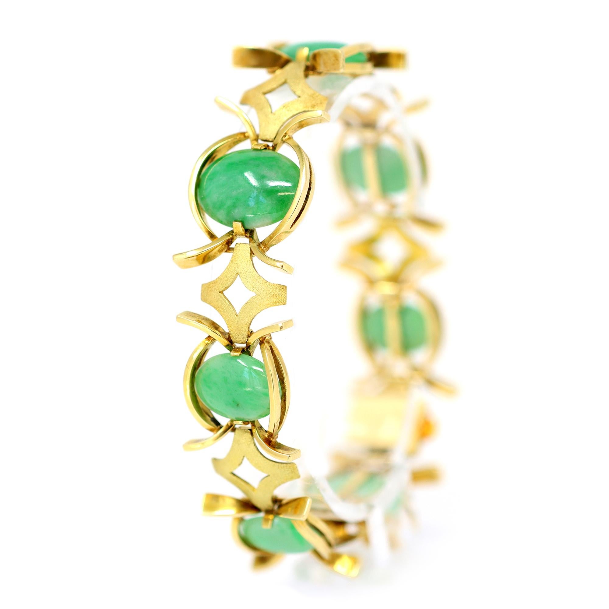 A Jadeite jade cabochon and 18 karat yellow gold bracelet, designed as segment style textured gold links spaced by the jade cabochons. The gross weight is 46.7 grams, length 7¾ inches, width ⅞ inch. The bracelet is circa 1970.