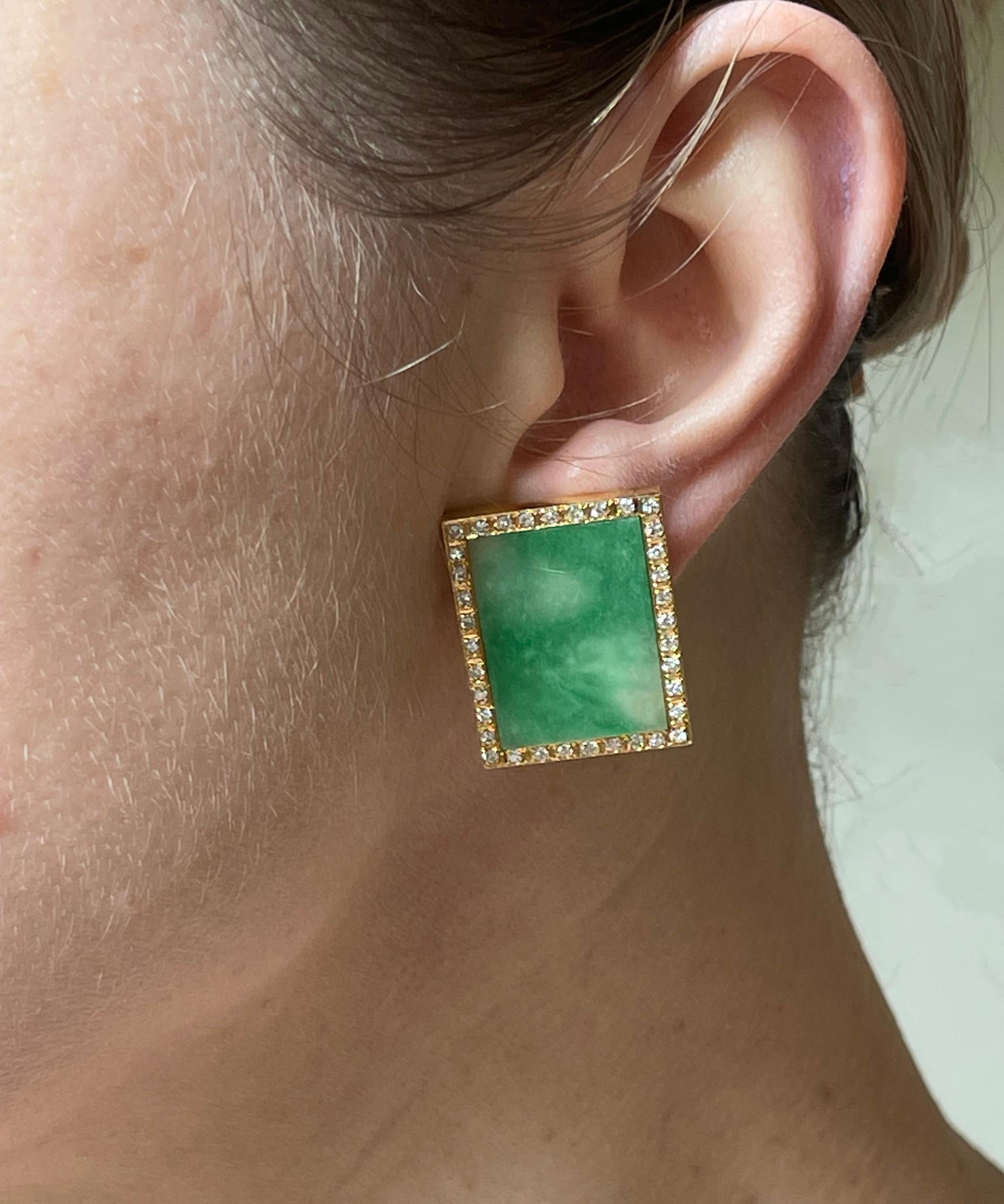 Pair of rectangular 14k gold earrings, set with center natural jadeite jade stones - measure approx. 22mm x 16mm. Jade is surrounded with a total of approx. 0.70ctw in H/SI diamonds. Earrings measure 1 1/16
