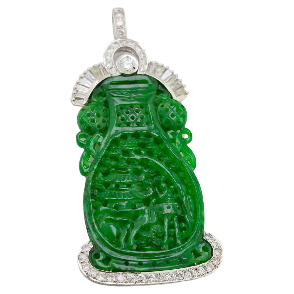 The detail in this 38.50 X 22.15 X 4.47 mm carved plaque is so rare and intricate, it is carved from a single piece of natural, green, translucent jadeite jade carved from the outside to the inside, featuring two different themes on front a vase