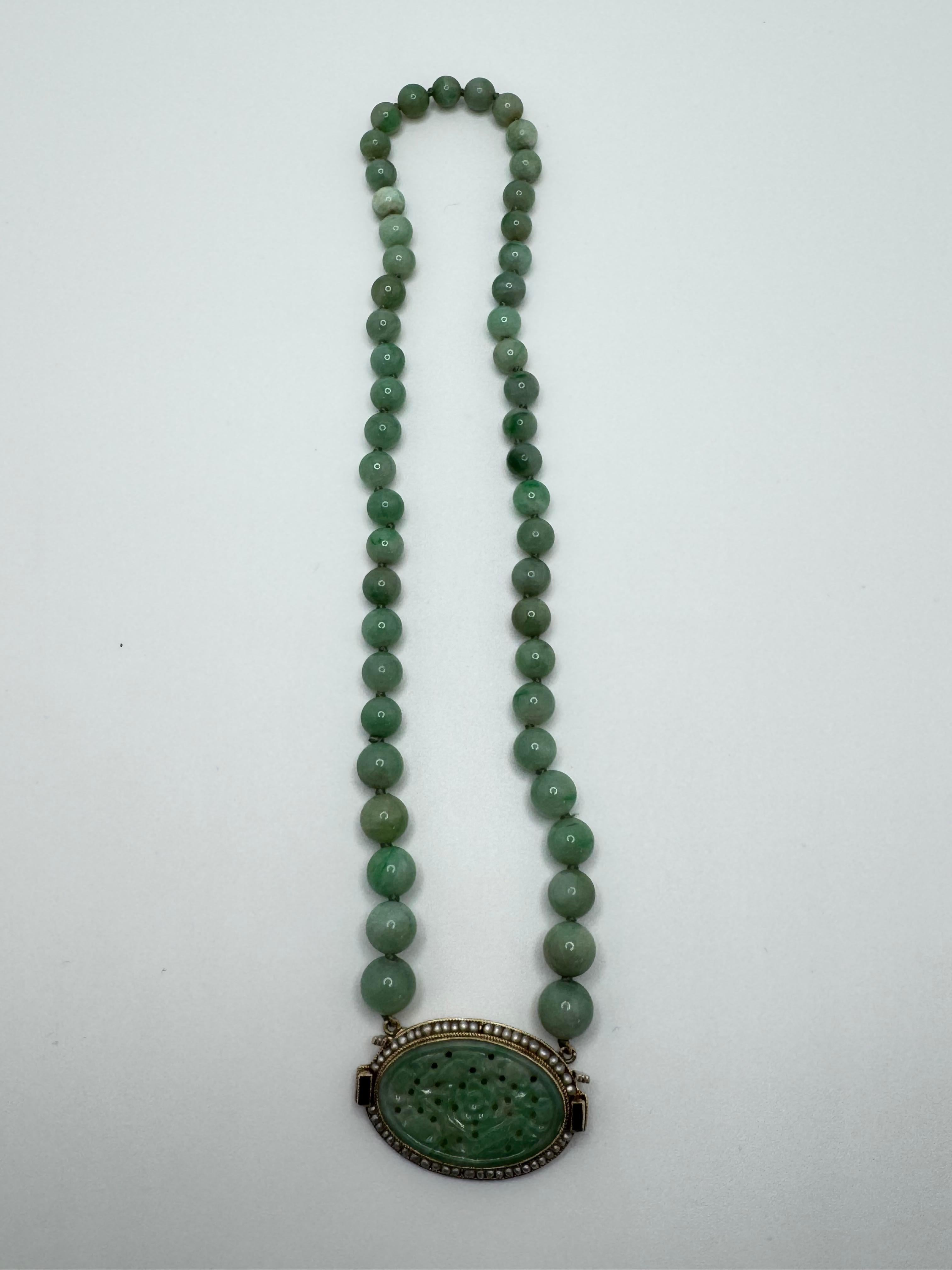 This elegant multi-strand beaded necklace showcases varying shades of green, beautifully complemented by dyed green quartz accents and two deep green tourmaline stones. Measuring 17.5 inches in length, the necklace is designed with meticulous