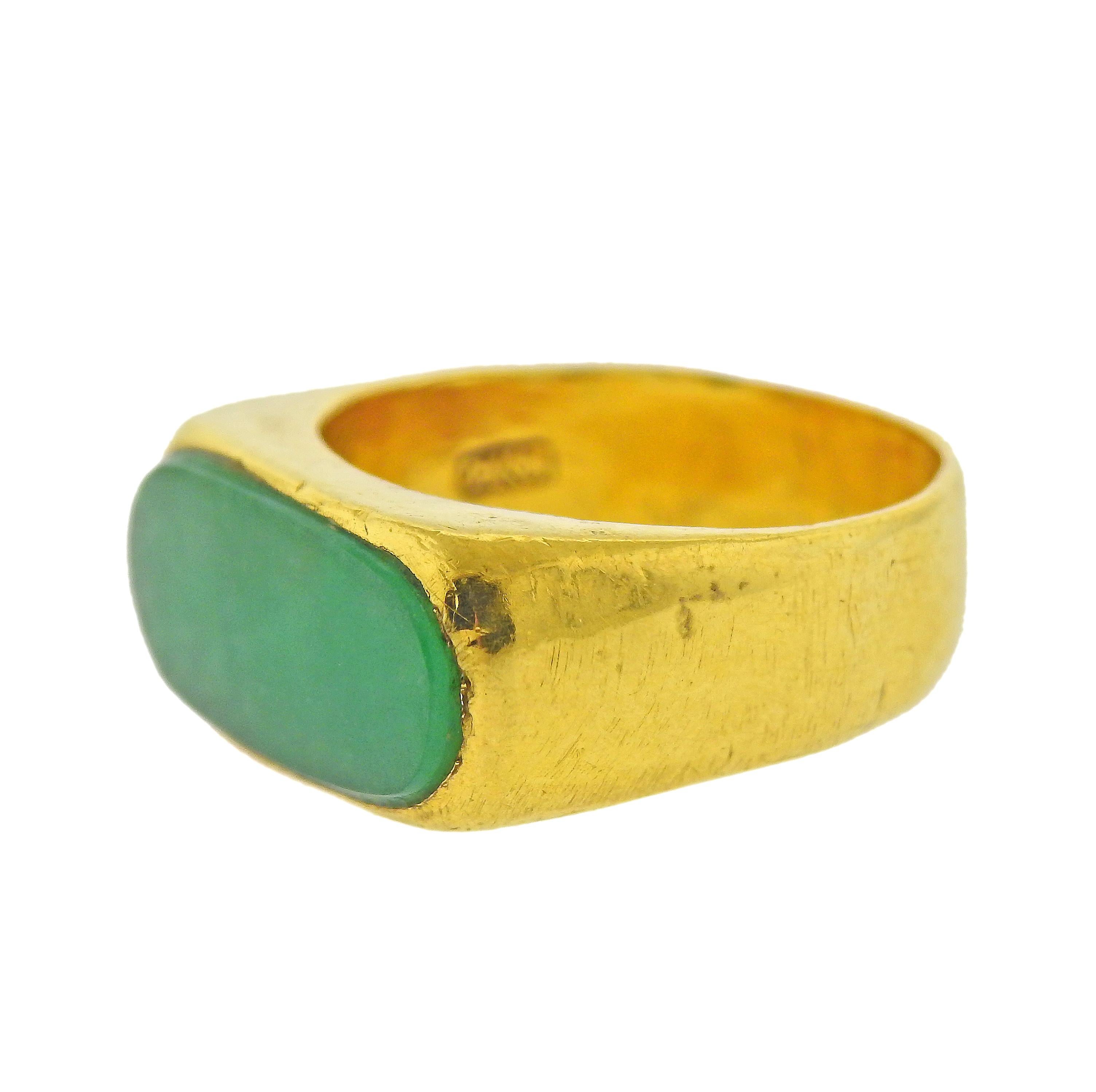 24k yellow gold ring, with natural jadeite jade, measuring 18.3 x 8.6 x 2.6mm. Ring size - 8.75, ring top is 10mm wide. Marked:999, Asian mark. Weight - 14.1 grams.