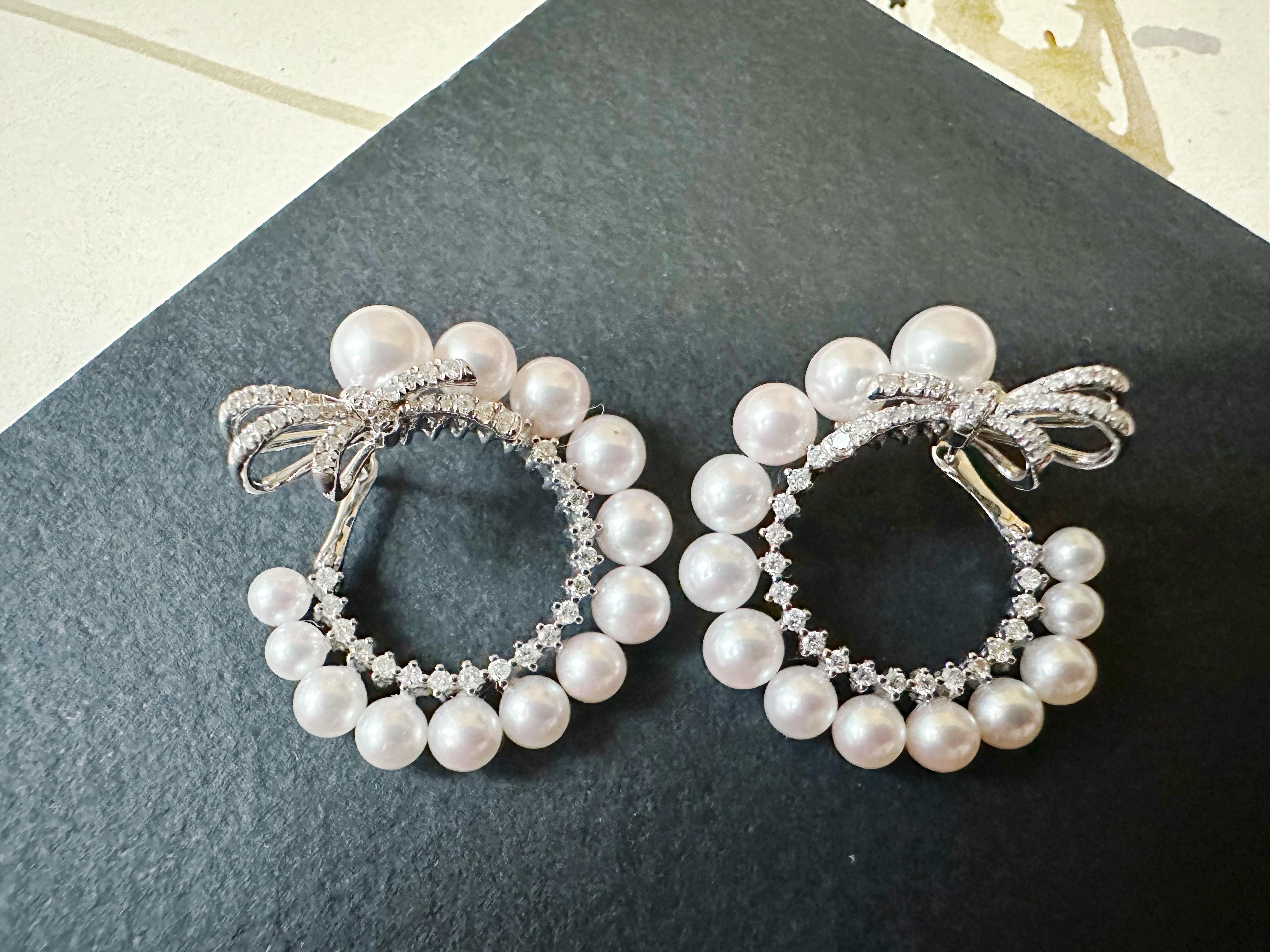 Discover elegance with our exquisite pearl loop earrings, designed to make a statement. Each earring features a lustrous pearl suspended within a delicate loop, adorned with shimmering diamonds that add a touch of sparkle and sophistication. The