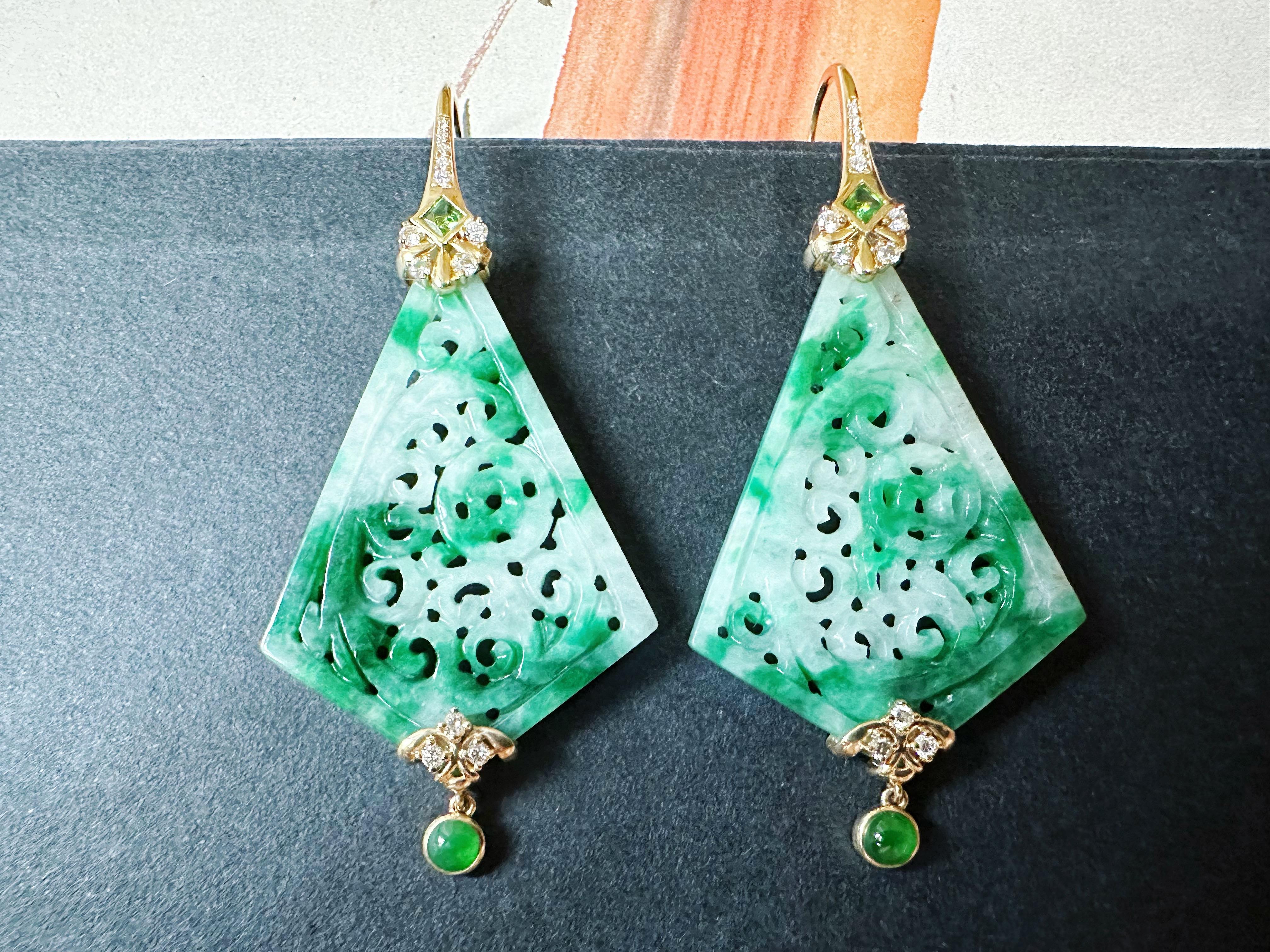 Discover the allure of these stunning kite shape jade carved earrings, expertly crafted to blend traditional artistry with modern elegance. Set in luxurious 18K gold, these earrings feature exquisite jade that captures the eye.

Adorned with