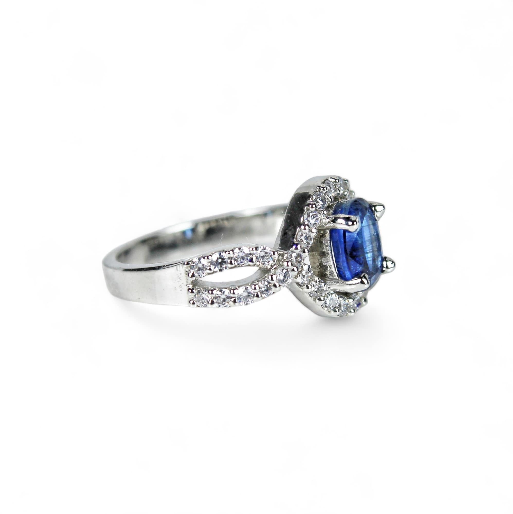 Metal - Silver
Indian ring size - 11
Product gross Weight - 3.090 Grams
Gemstone - Natural Kyanite
Total stone weight - 1.2 Carat
Stone shape - Oval
Stone size - 7 x 5 mm
Diamonds - Swarovski

Kyanite is a beautiful gemstone and is believed to help