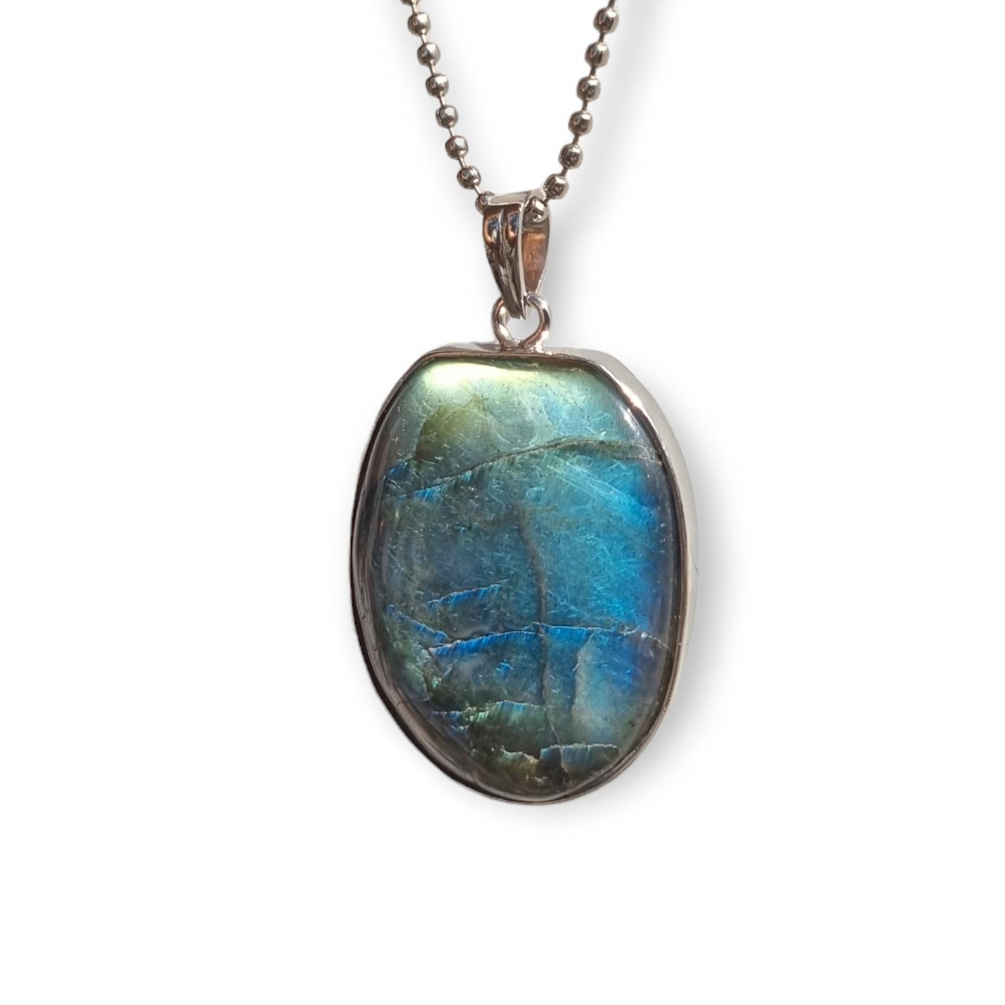 Product Specifications:

Gemstone - Labradorite 
Carat weight - 105.30 Carat
Total piece weight - 24.67 grams
Metal - sterling silver
Metal weight - 3.6 grams
Pendant dimensions - 53 x 31 x 4 mm

The Labradorite stone is known for its unique,