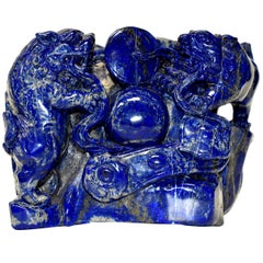 Bloc de 8 livres de lapis-lazuli naturel avec des lions sculptés