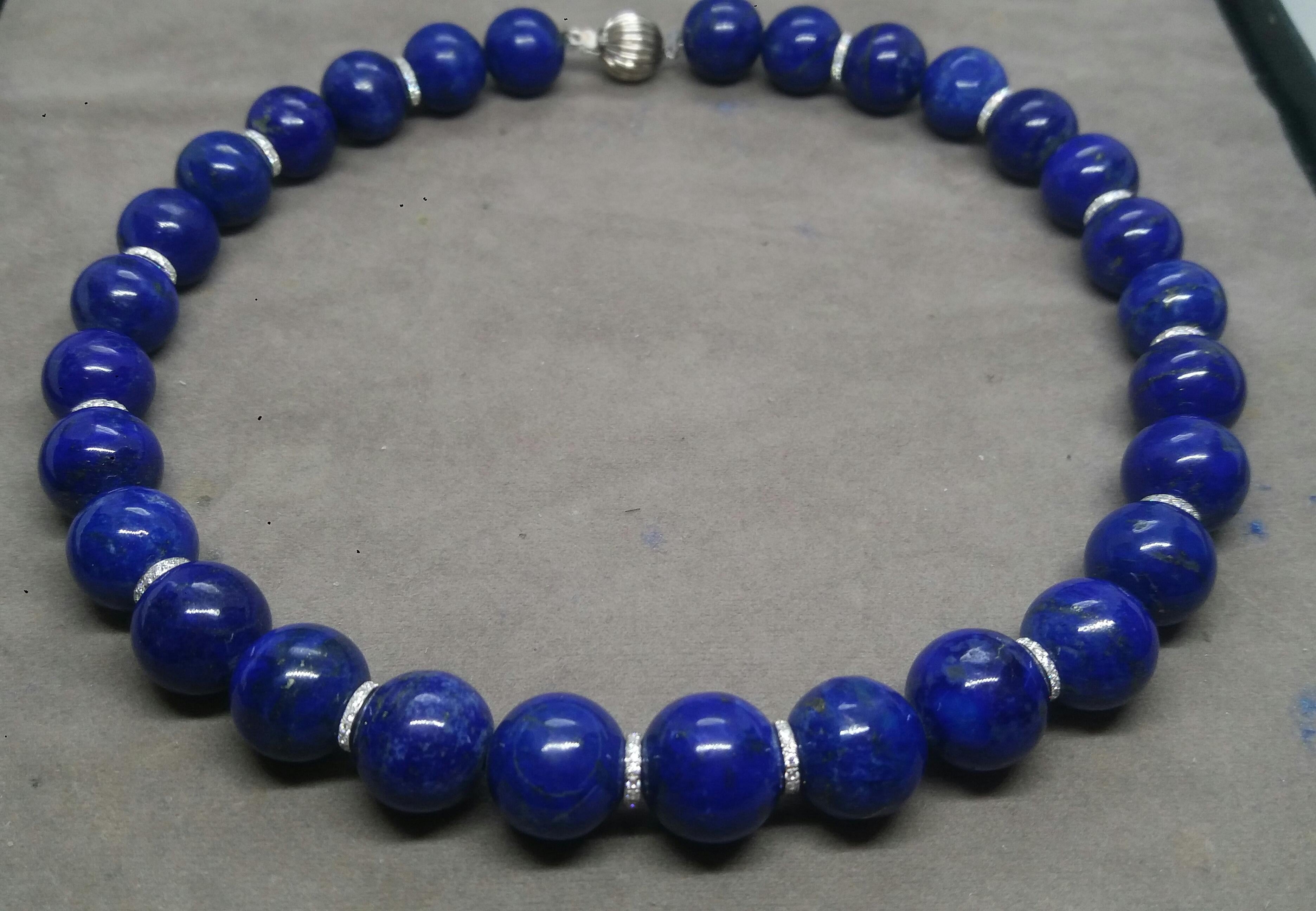 Natural Color Afghanistan Lapis Lazuli Round Beads Necklace strung with 14k White Gold and Diamonds spacers for a total of more than 1 carat of full cut diamonds..Round Shape Clasp also in 14K white gold.

In 1978 our workshop started in Italy to