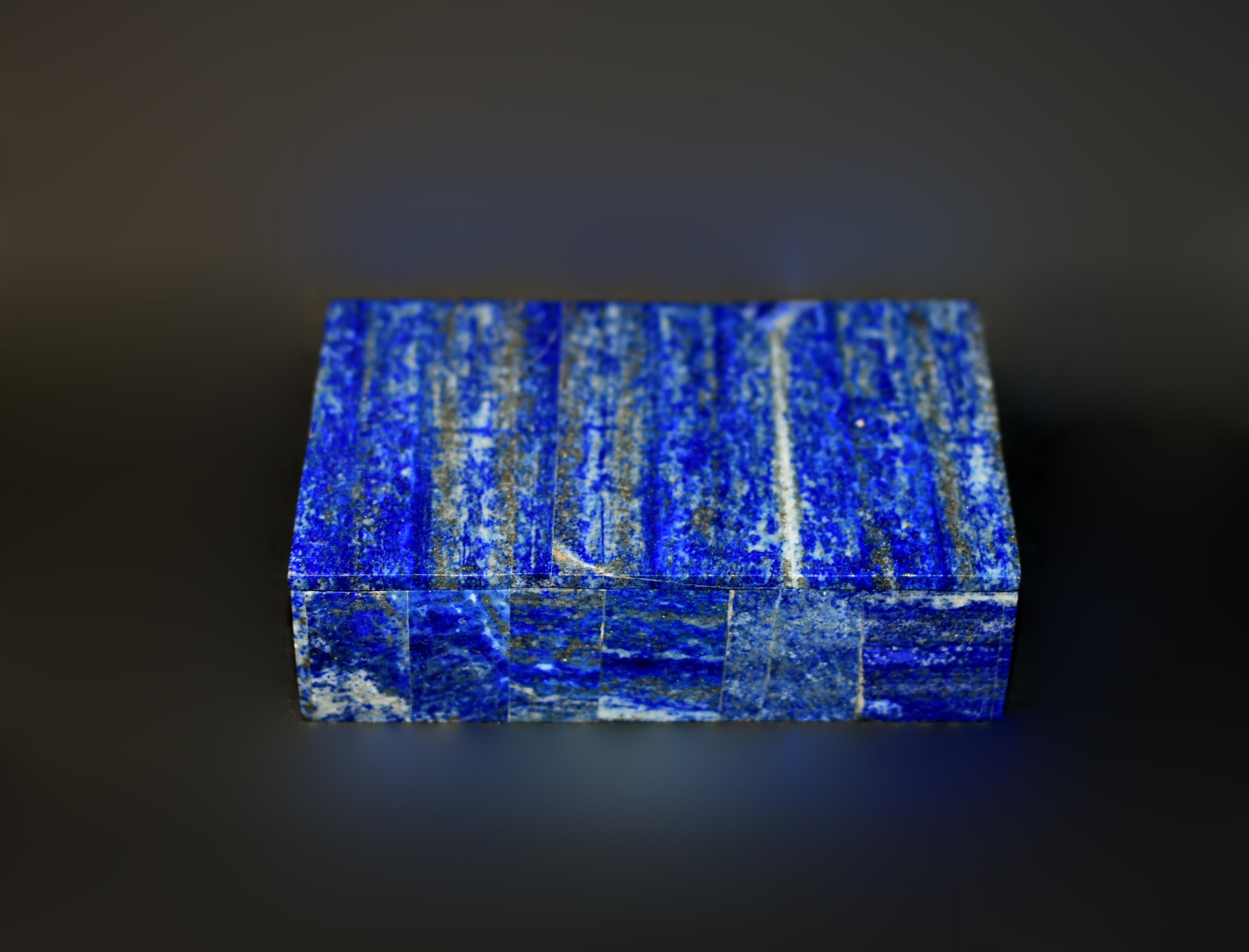 A beautiful vintage natural lapis box. Crafted from the finest grade AAA natural lapis lazuli, the box uses carefully selected pieces resembling a forest of trees against blue skies. Saturated cobalt blue with splendid gold sparkles. Interior with