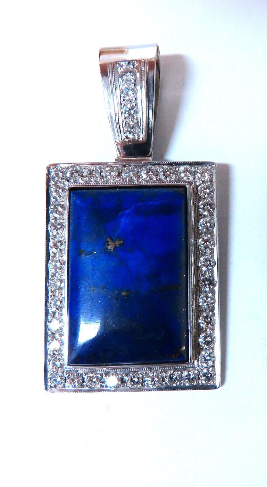 2.50ct Natural Diamonds & Lapis Pendant.

Rectangular Shaped and Cabochon cut

Vibrant Blue color

28 x 18mm

2.50ct. Natural Diamonds.

 Rounds Full cut brilliants

Vs-2 clarity H-color.

Overall pendant:

38 x 29mm (without bale)

Depth: 7mm

14Kt
