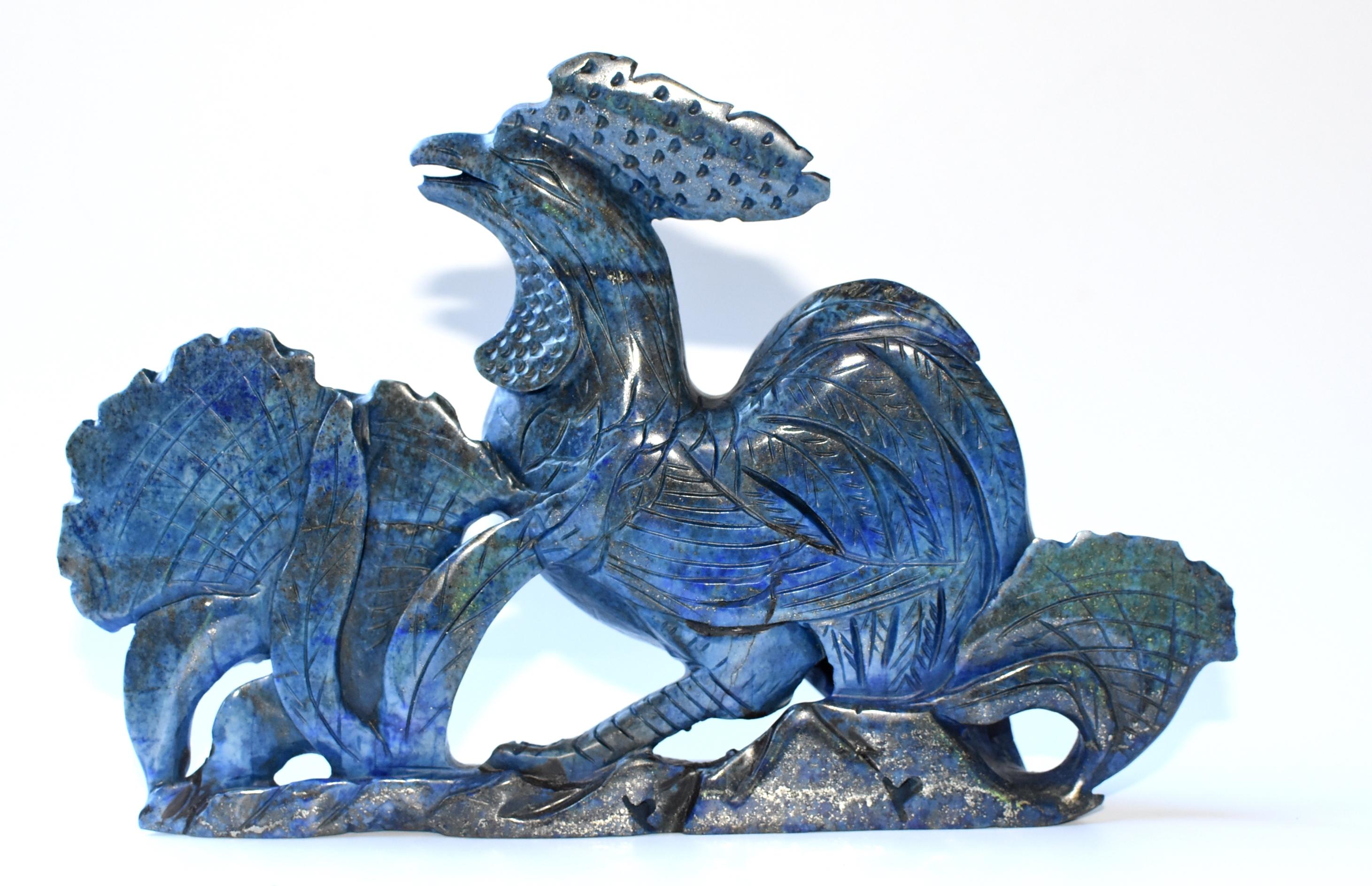 Beautiful lapis sculpture of a rooster. All natural lapis lazulli weighing 2 lb. Nicely carved. A great auspicious symbol for good news and prosperity.

