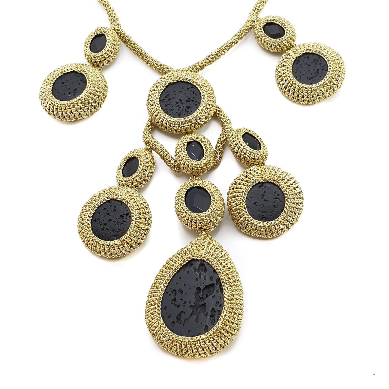 This is a one of kind statement necklace suitable for everyday and evening wear. The necklace is crochet with a golden smooth passing, none tarnishable thread, hand crochet with large natural black Lava stones