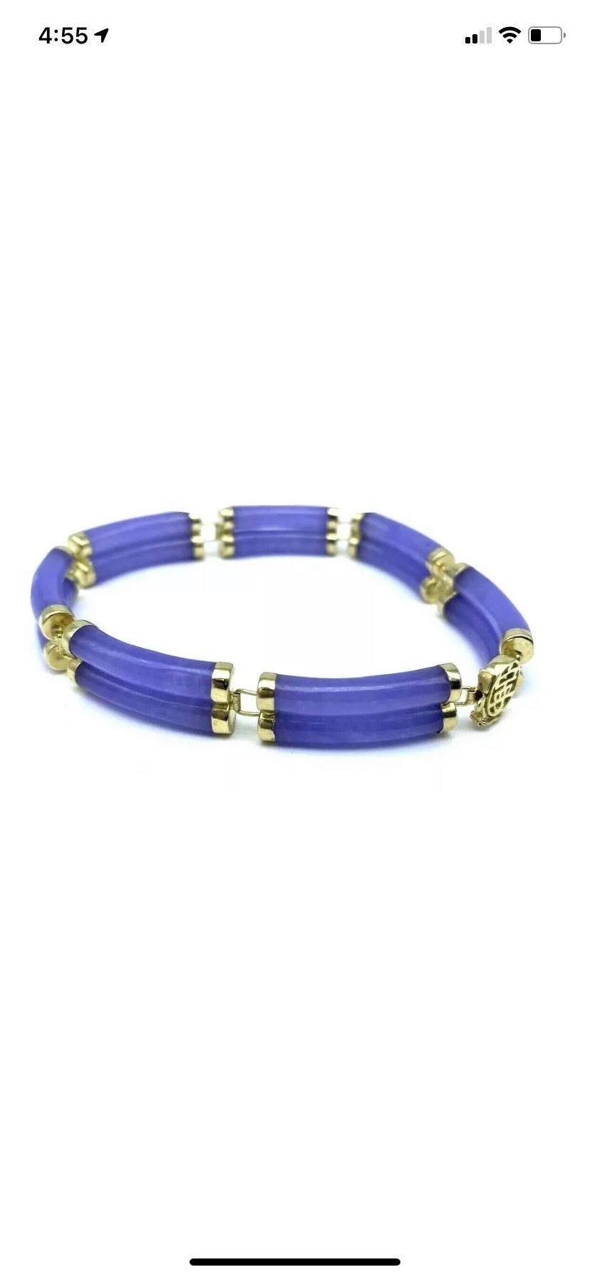 Lavender jade double row link style bracelet 
The beautiful Jade color is natural purple.

14 Carat yellow gold caps and clasp. The length is 8 inches. 

Excellent brand new condition set in rich colored 14 karat yellow gold.

GIA Gemologist