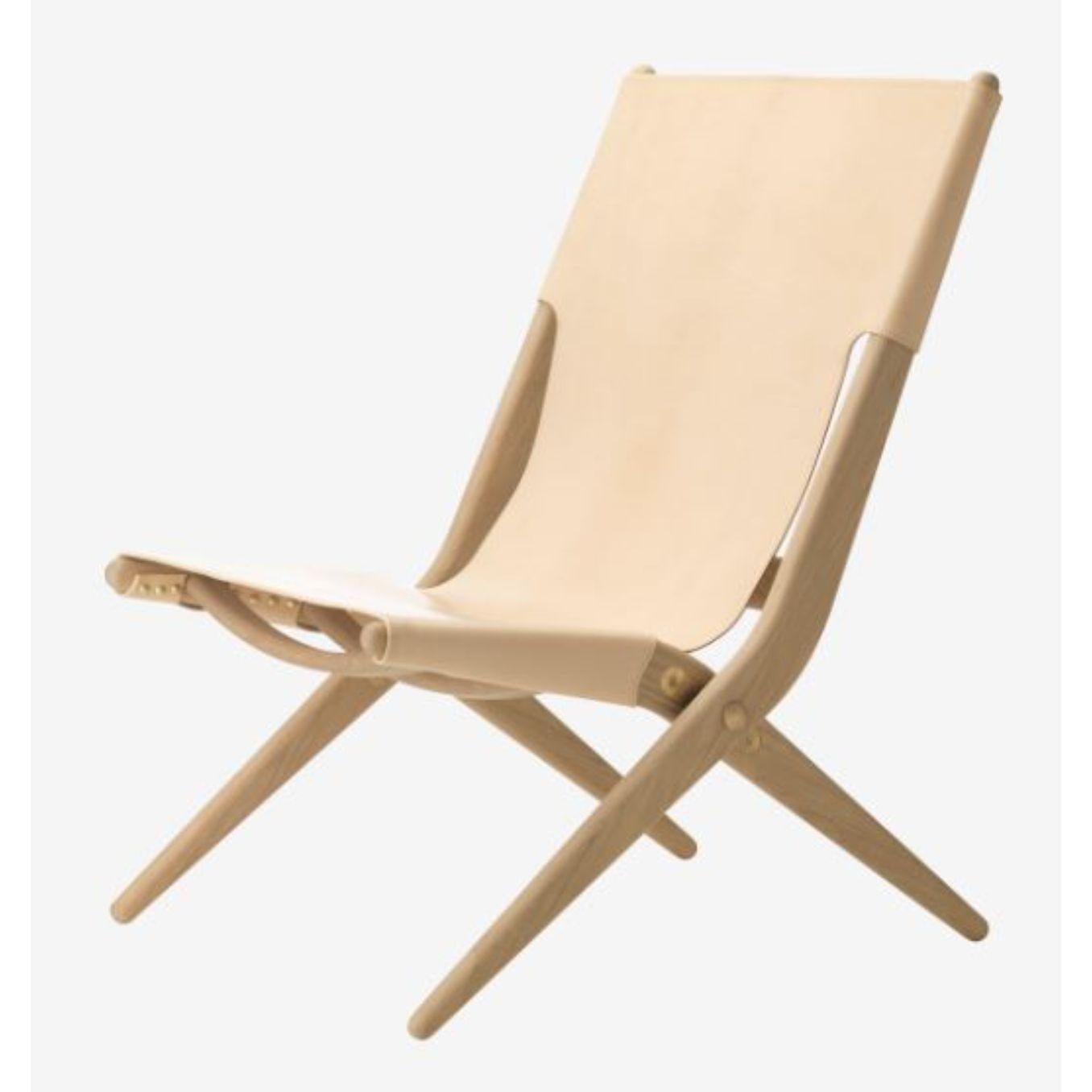 Natural leather saxe chair by Lassen
Dimensions: D 67 x W 60 x H 84 cm 
Materials: Leather, wood, soap treated oak
Also available in different colors and materials. 
Weight: 13 Kg

Mogens Lassen was perceived as ‘the naughty boy in class’, but