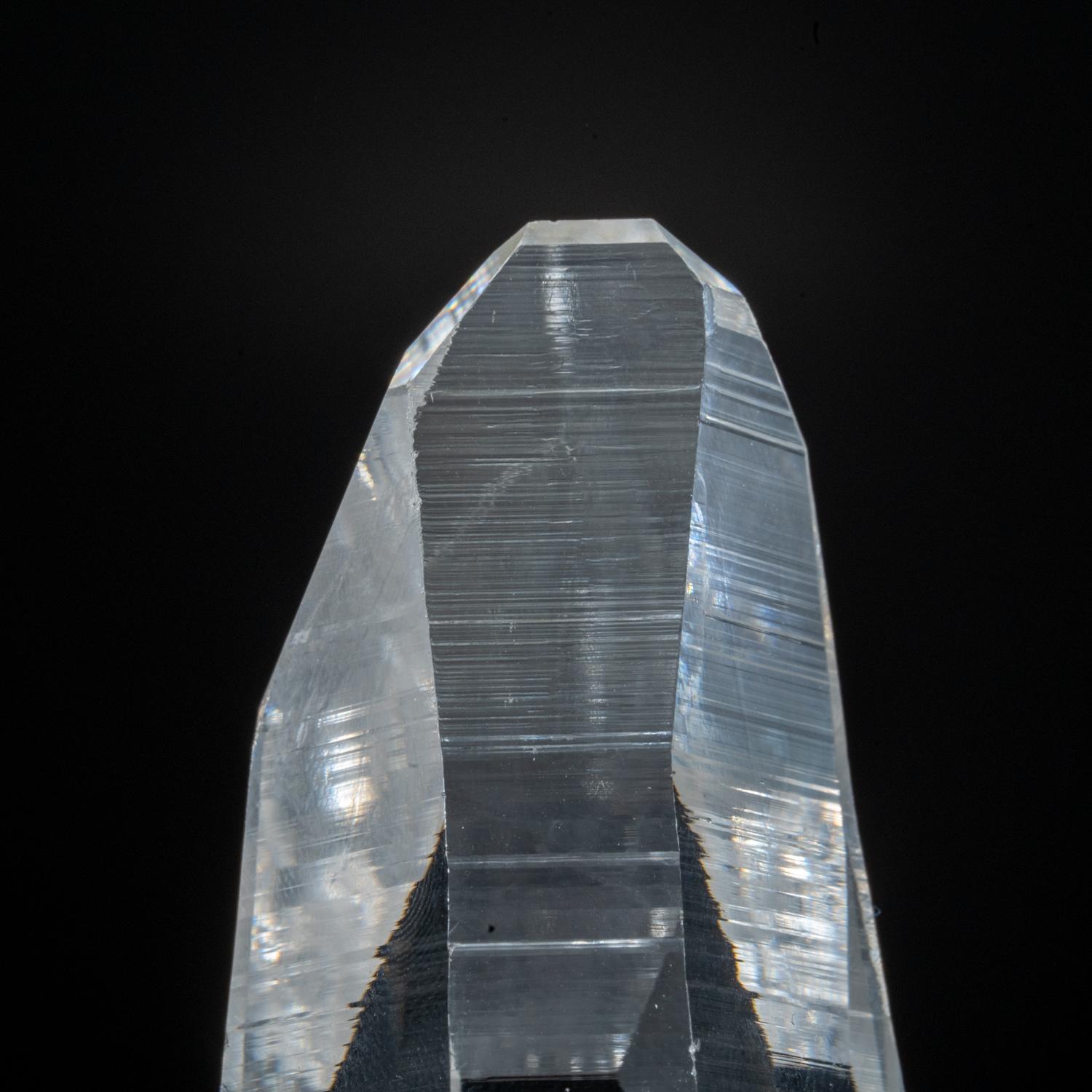 This natural 125.6 grams Brazilian Lemurian Quartz is a large single specimen, featuring transparency and an intact termination. No damage is present, and the crystal is unpolished. Clear Quartz is famously known as the 