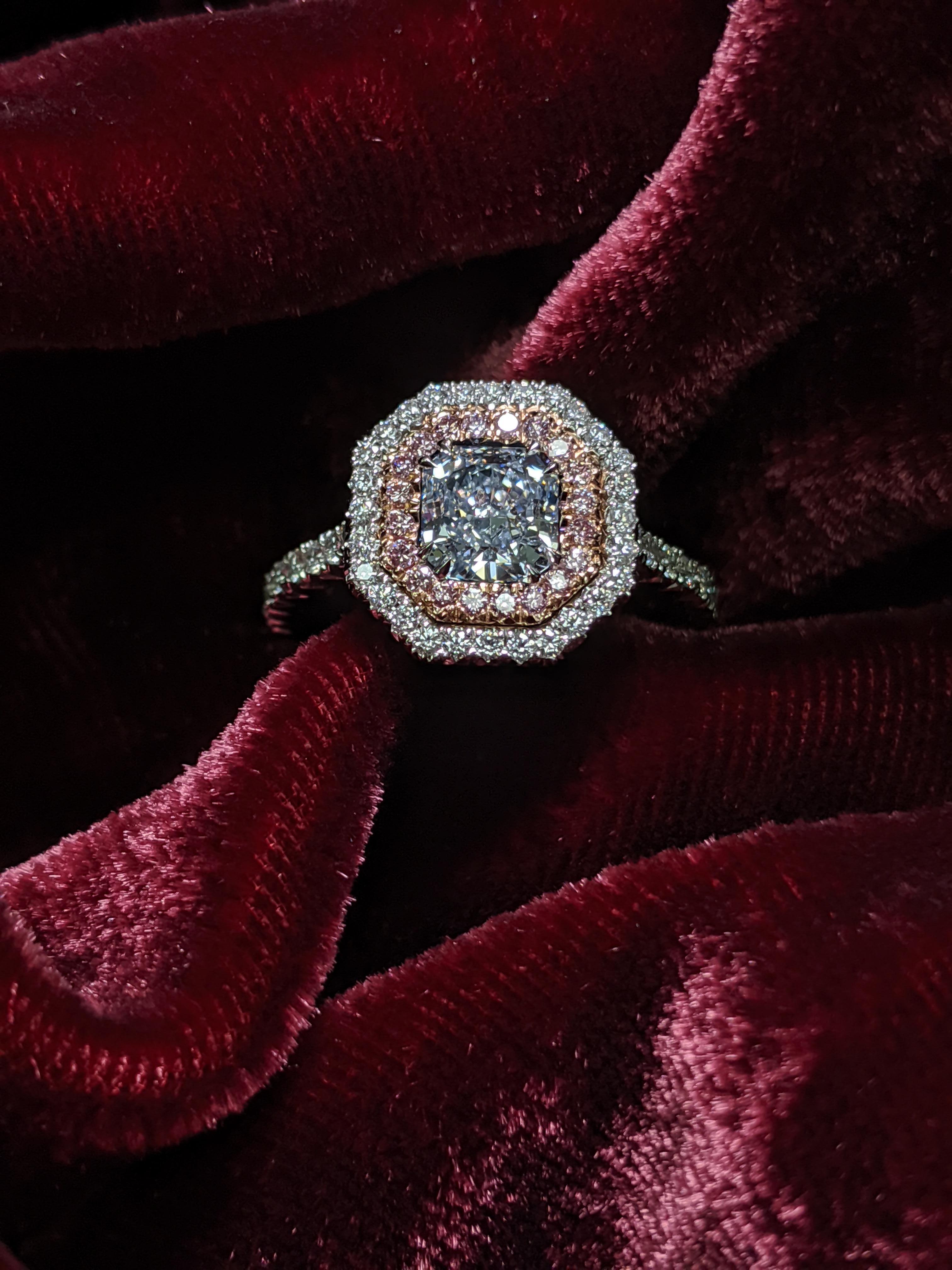 Natural Light Blue Diamond of 0.85 carats VVS2 clarity in a pink and white double halo mounted in platinum.  Both special in rarity and refined in size this ring is a great opportunity to add a natural fancy blue diamond to your collection. 