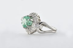 Natural Light Green Emerald and Diamond Halo Ring