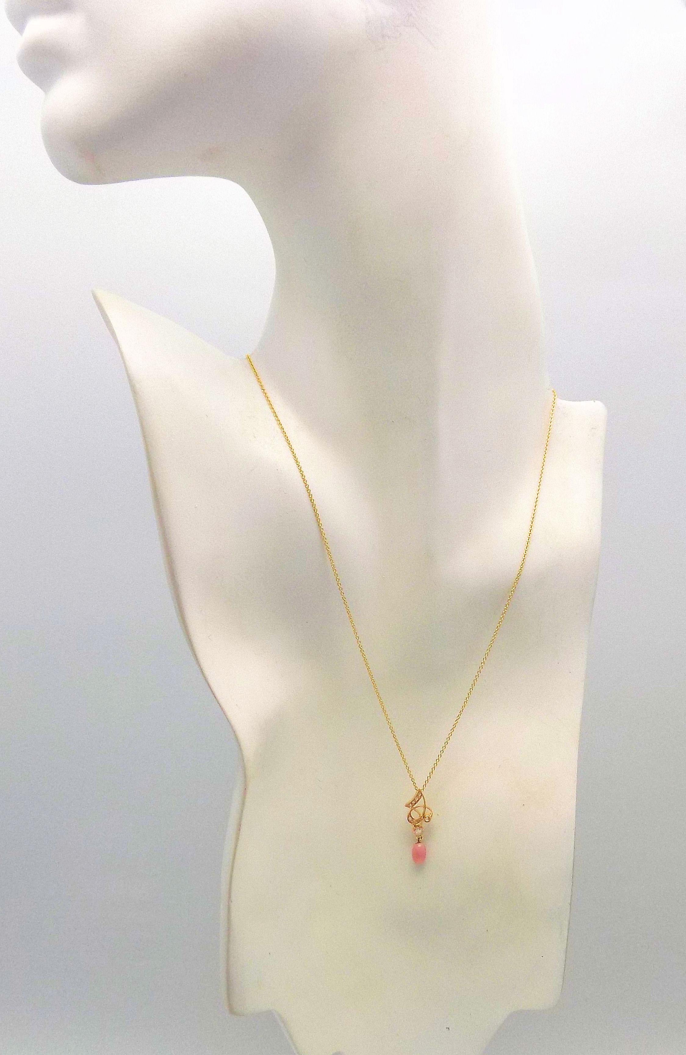 14 Karat Yellow Gold Setting and Chain. Natural Light Pink Conch Pearl with the All-Important Visible Flame. Nice Oval Shape. It Measure 6.9 MM Long X 4 MM Wide.  16