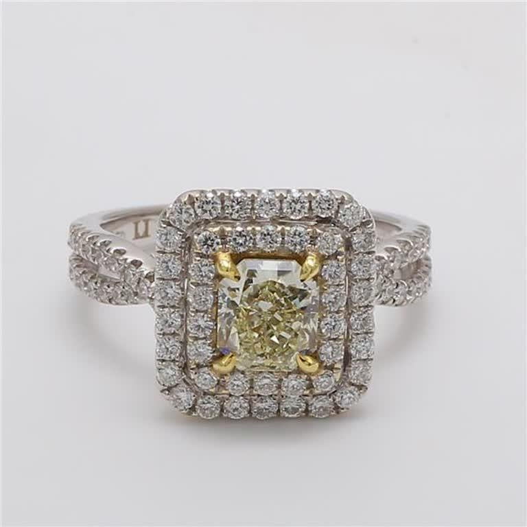 Rare radiant natural yellow diamond surrounded with natural round white diamonds. This ring is designed to be in a simple setting. Can be used as an engagement ring or in addition to your collection of jewels. 

Total Weight: 1.97cts

Center Stone