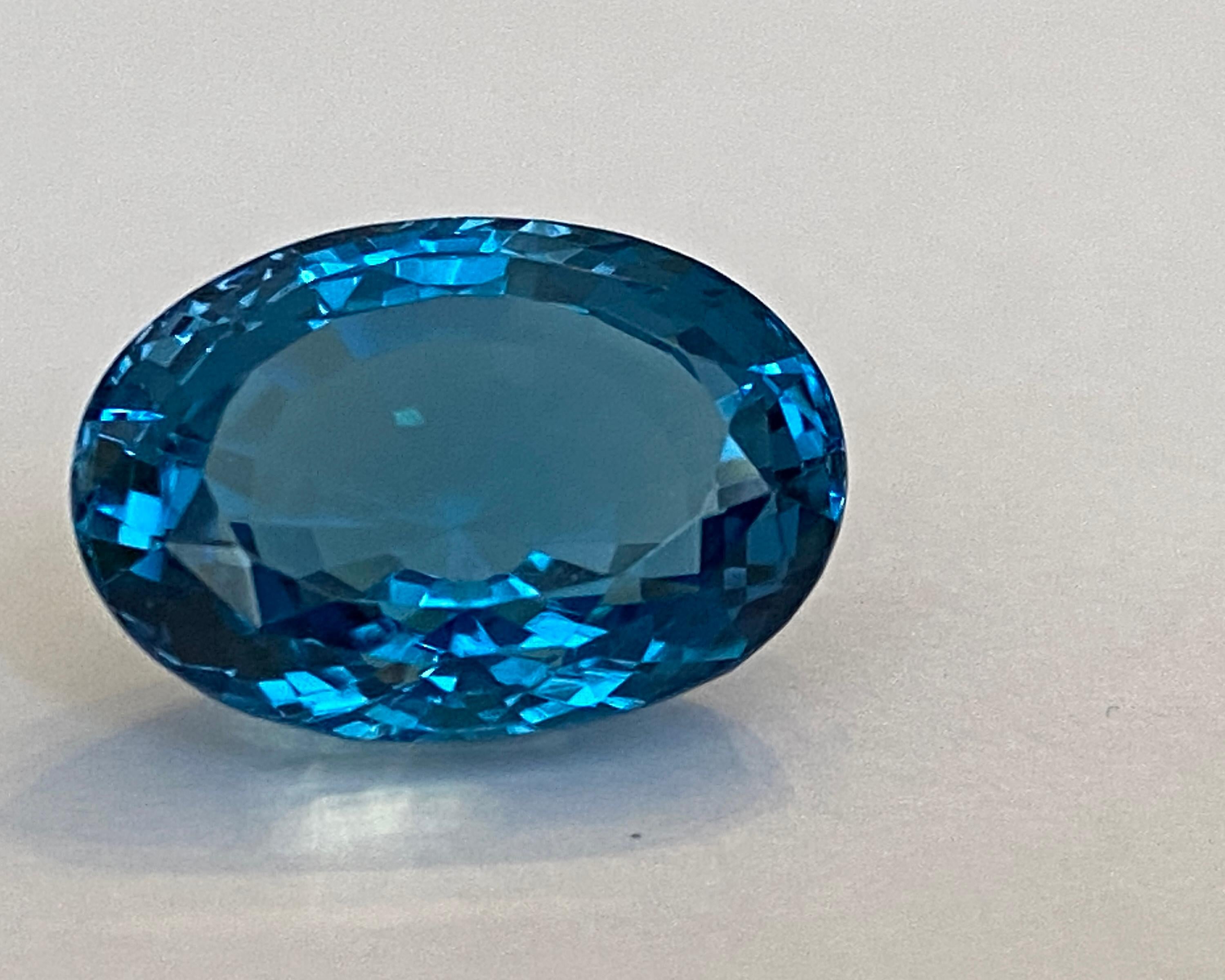  Offered  Oval Mixed cut Natural Gemstone Flawless London Blue Topaz 21.23 ct.
It's 'AAA' Quality & Loop Clean Gemstone. Transparent.   Ideal for ring of  pendant!
Dimensions:13.08mm*18.35mm*14.59mm
Origin : Brazil
Treatment: heated
London Blue