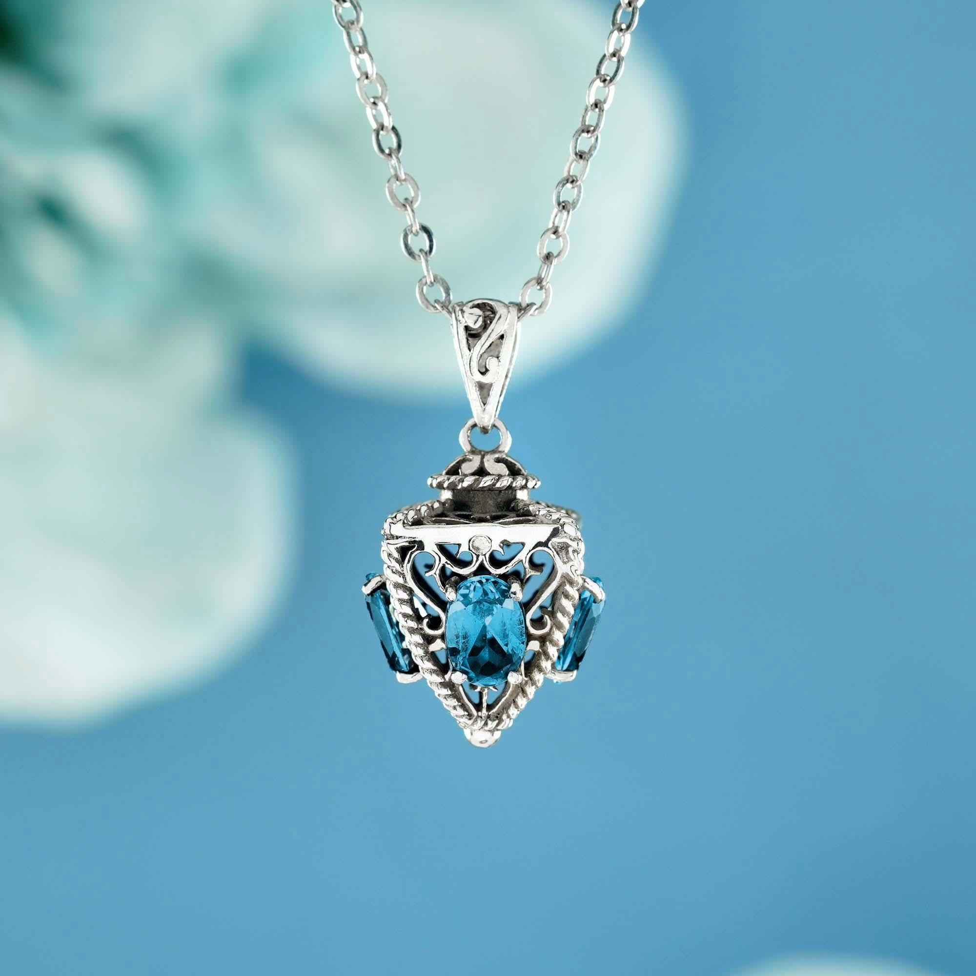 Discover our striking natural London blue topaz in pyramid shape vintage style pendant, crafted in 9k solid white gold. This exquisite piece features beautiful blue topaz on three sides of the polyhedron pendant, radiating elegance and charm. This
