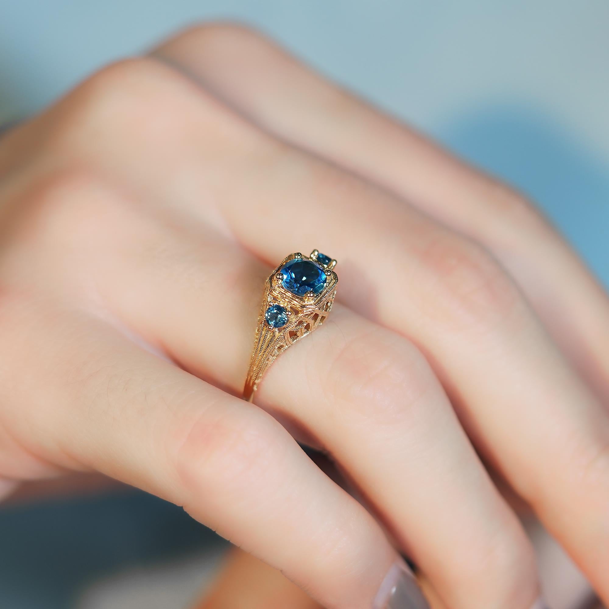 For Sale:  Natural London Blue Topaz Vintage Style Filigree Three Stone Ring in 9K Gold 7