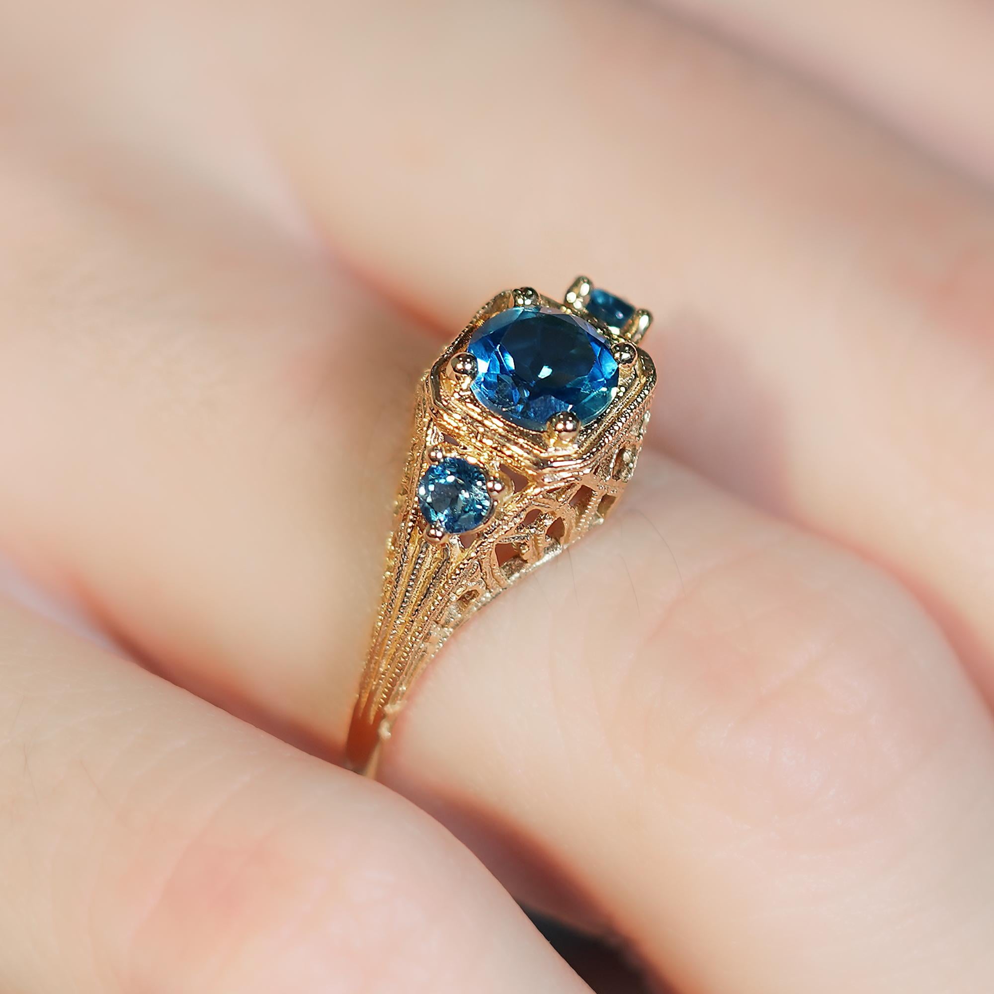 For Sale:  Natural London Blue Topaz Vintage Style Filigree Three Stone Ring in 9K Gold 8