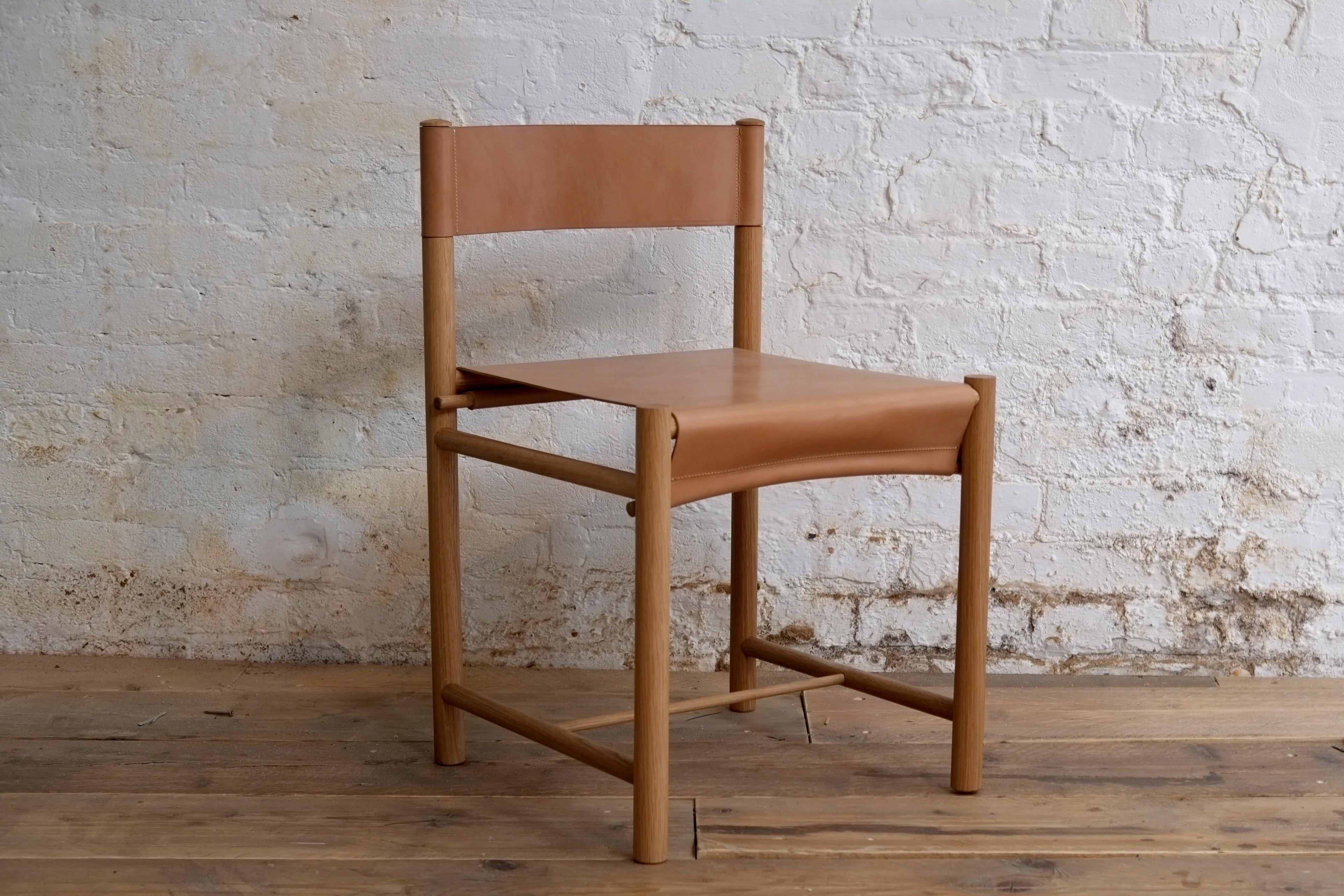 Natural loop chair by Fred Rigby Studio.
Dimensions: D 45 x W 45 x H 74 cm.
Materials: oak wood, leather.
Available in natural or black oak.

The Loop Chair is a celebration of simplicity, taking inspiration from ancient wooden looms and how