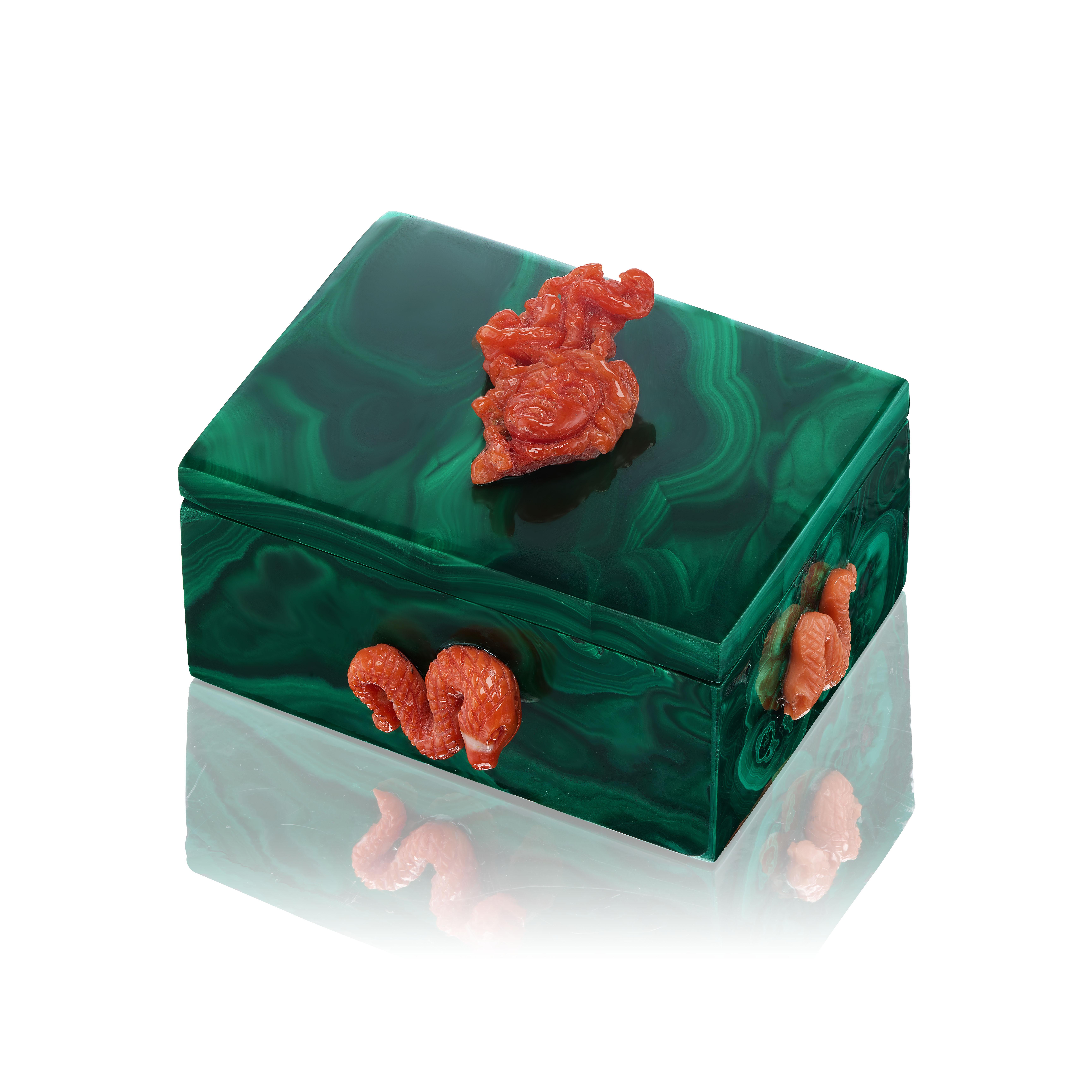 Indulge in the allure of natural gemstones with an exquisite touch of artistry. This stunning malachite box is a testament to the splendor of nature, meticulously crafted from individual slabs to showcase the breathtaking beauty of this captivating
