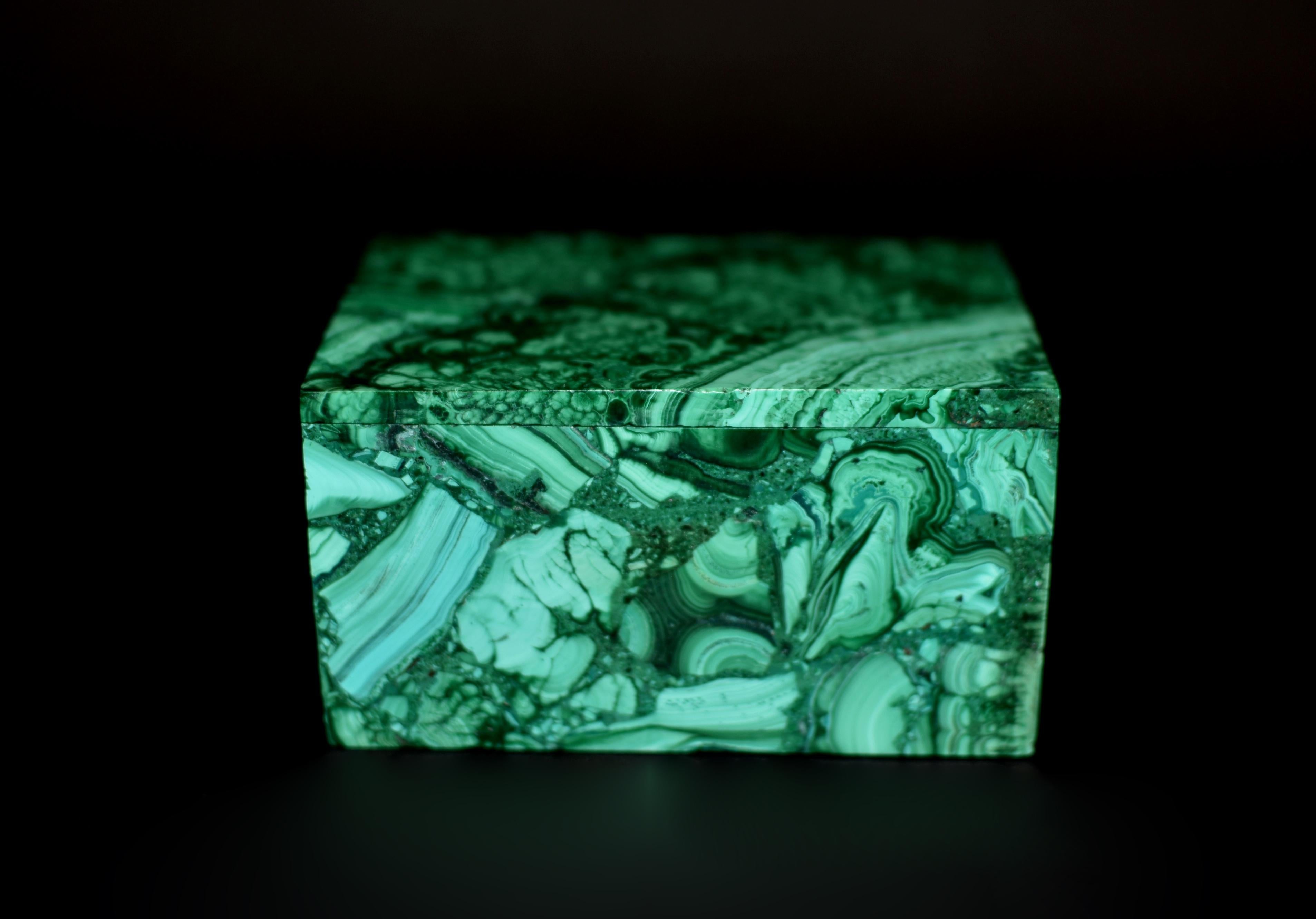 A beautiful 1.2 lb malachite box. The box is made of gemstone malachite with spectacular natural swirls and patterns. A remarkable objet d'art of quality, luxury and sophistication. Meticulously hand crafted and polished to a lustrous shine. A stone