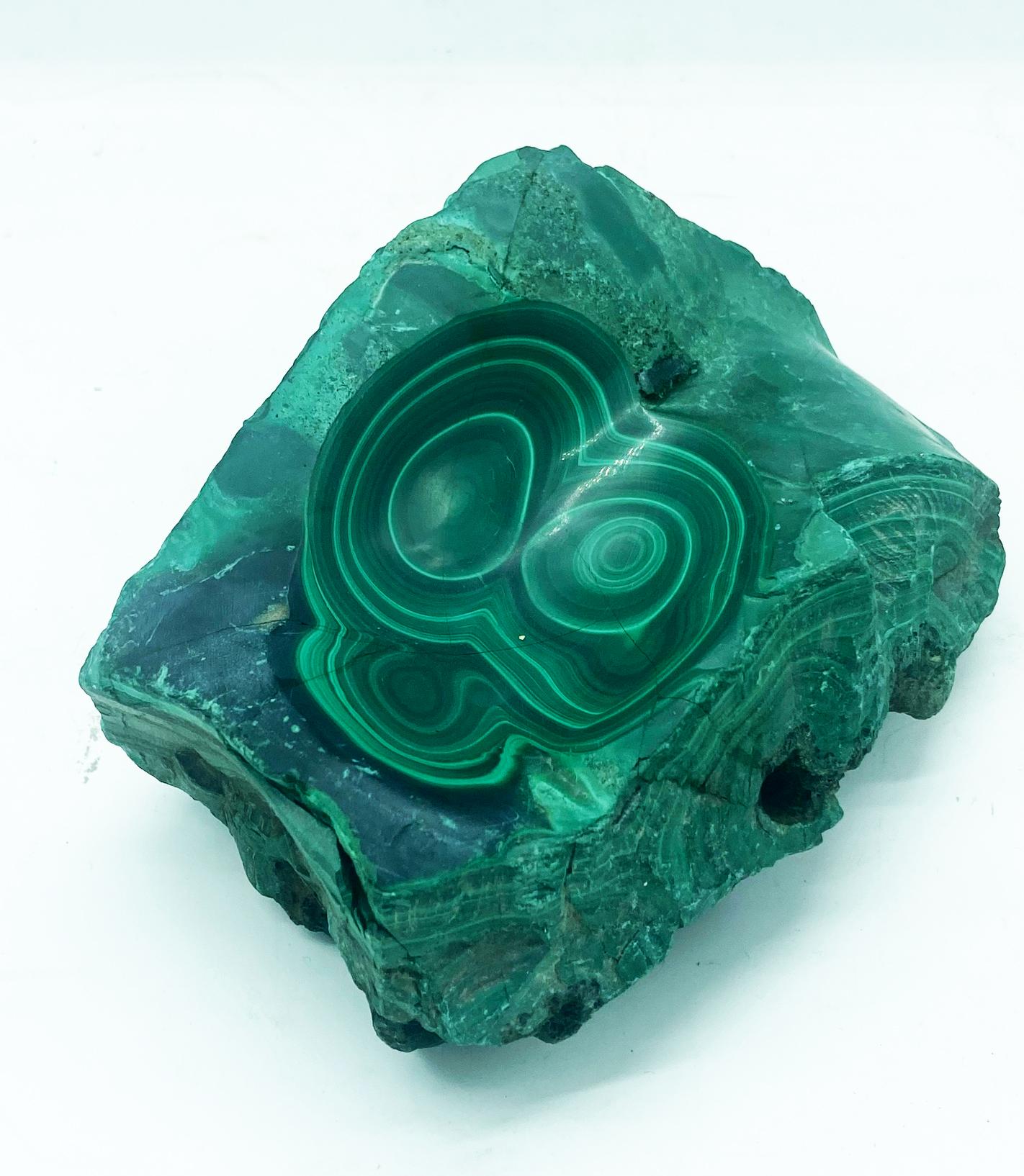 Decorative bowl or ashtray fashioned out of a piece of all natural malachite mineral stone. Polished beautifully to display the natural layerings and concentrics of the stone. 
 