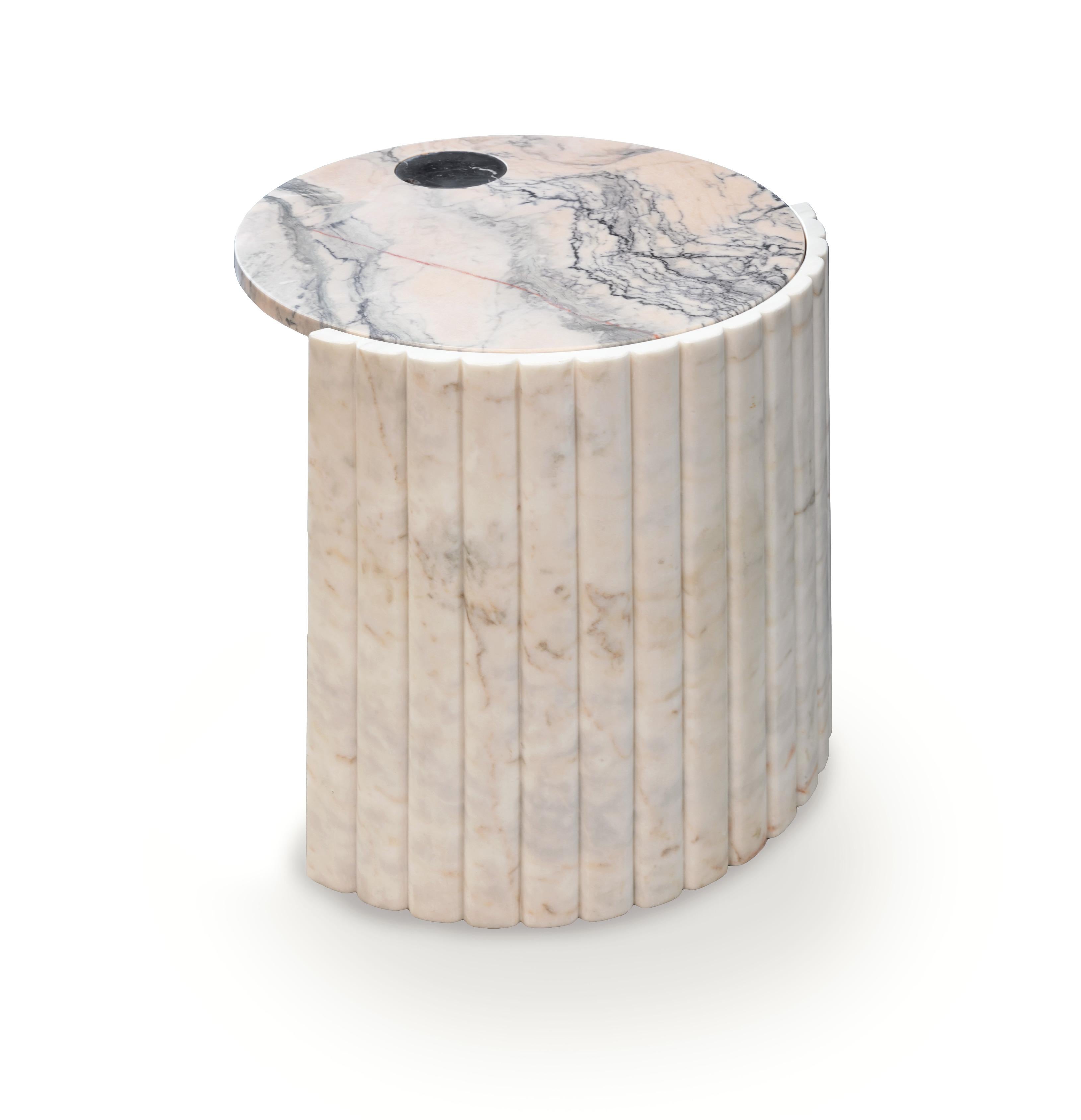 Helene side table is unique in its conception. The combination of different marbles like Estremoz marble, Nero Marquina and Estremoz pink marble makes this piece a sign of unconformity and originality. Made to order. 
