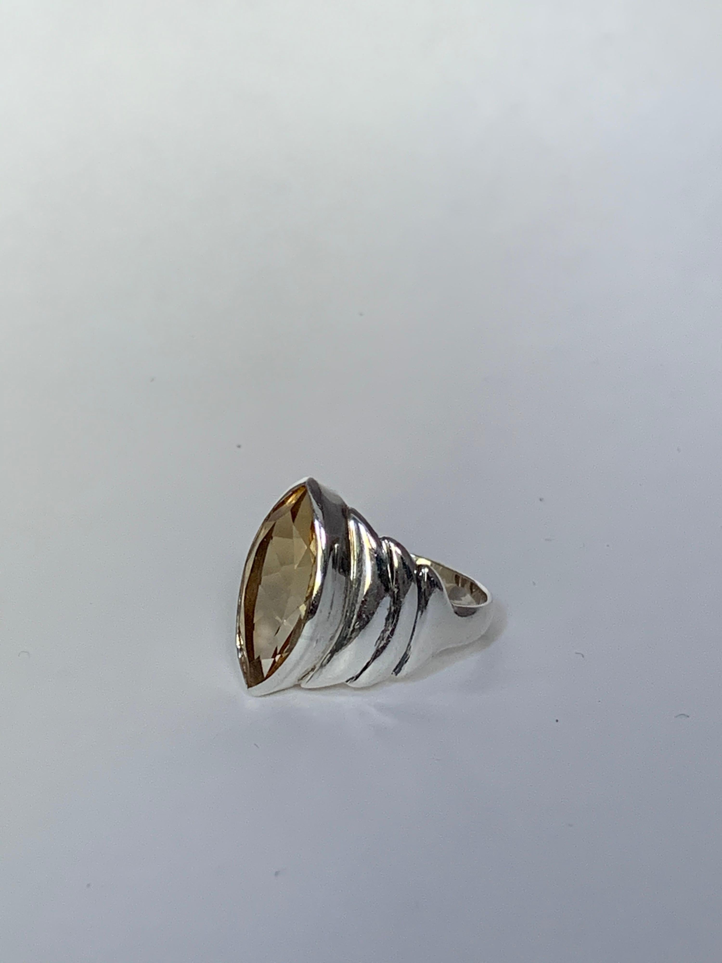 One of a kind handcrafted Marquises Shape citrine which is 10mm X 20 mm .The stone is set in sterling silver is size 9 ring, if needed the ring can be resized.