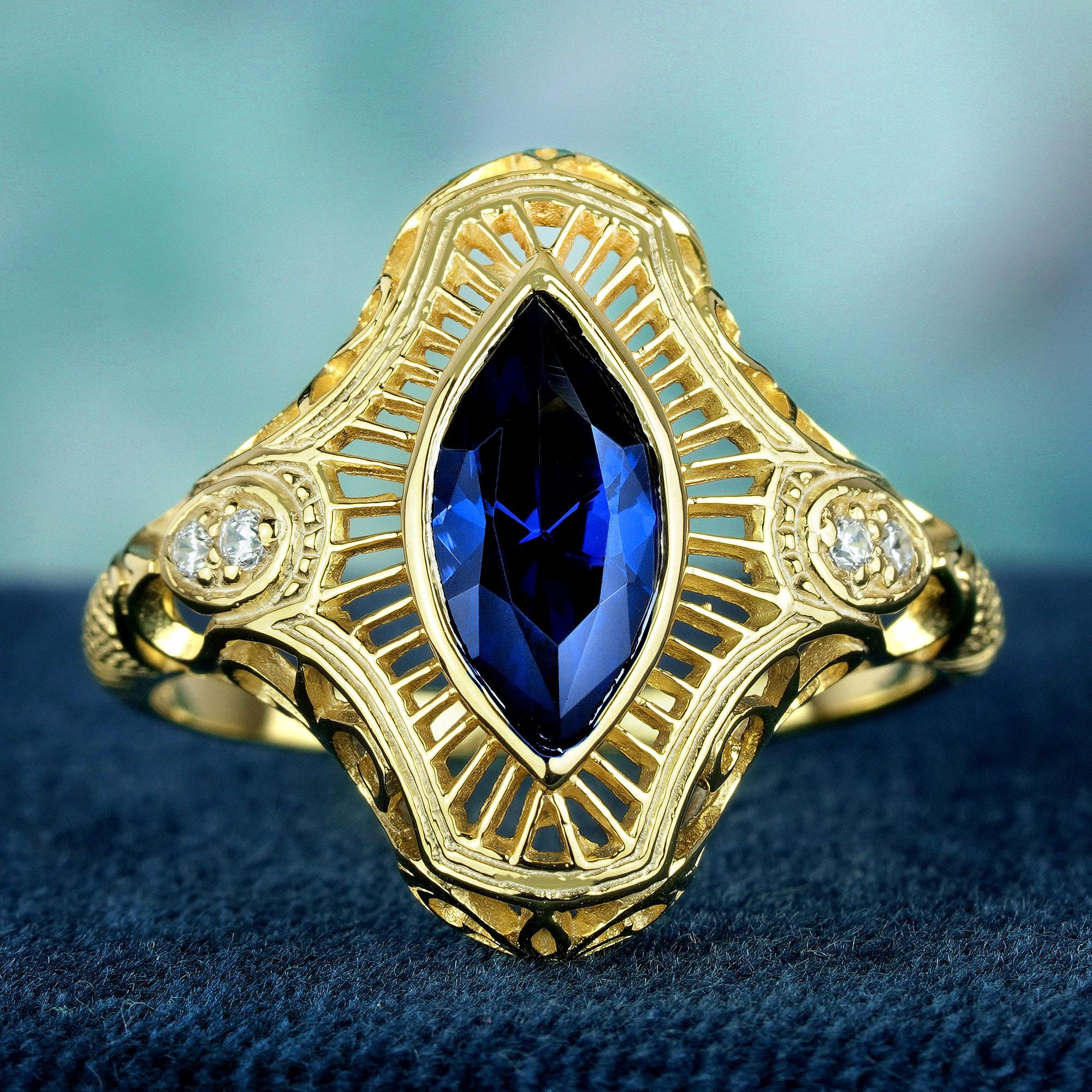 Indulge in timeless elegance with our marquise blue sapphire Art Deco Style ring. Crafted in white gold, Enhanced by round diamonds on each side, its exquisite filigree design exudes sophistication and charm. Elevate your style with this stunning