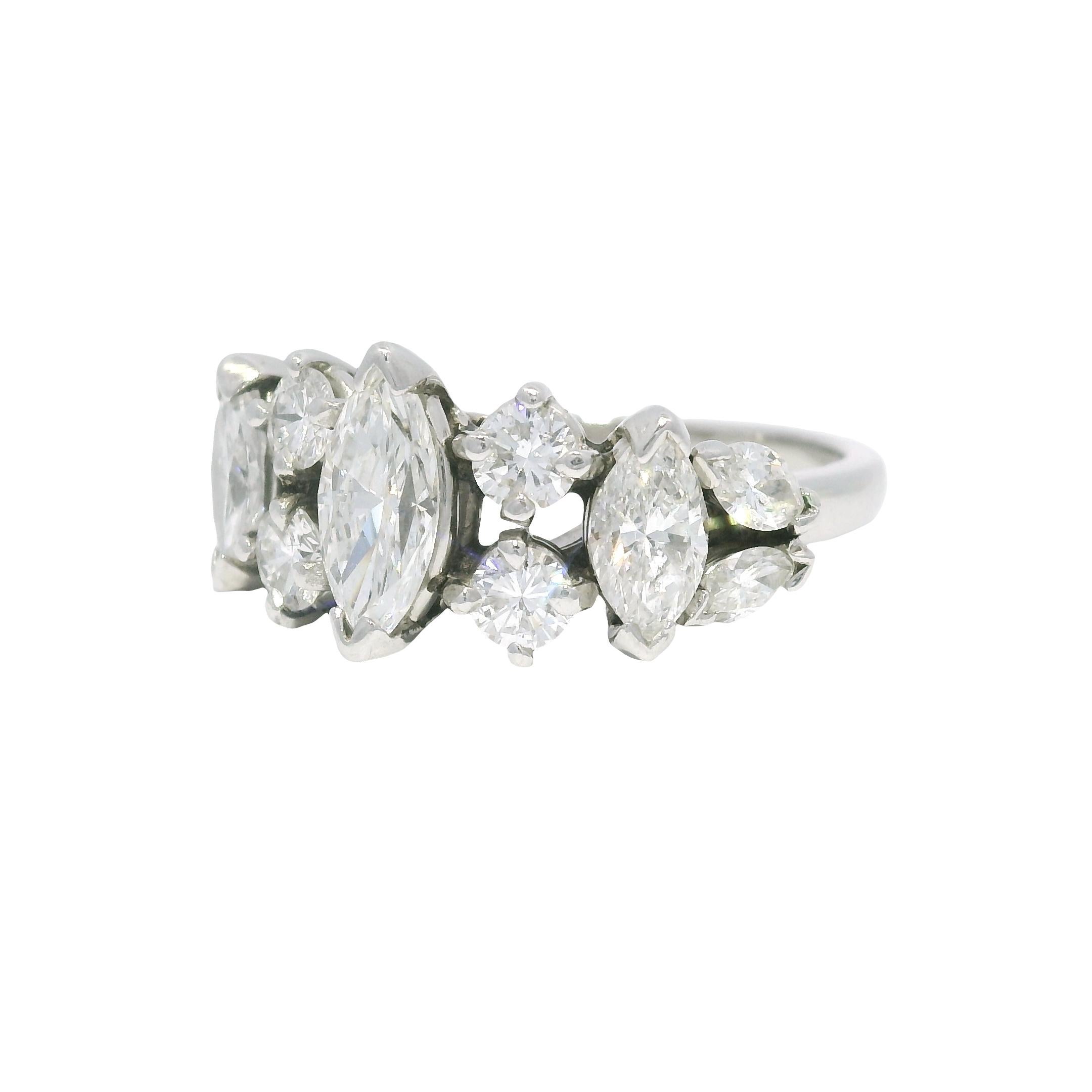 Platinum Natural Marquise Cut Diamond With Accent Side Stones Ring

Material: Platinum
Diamond Details: There are (7) natural, Marquise cut diamonds and (4) natural, round brilliant diamonds weighing approximately 1.30 carats total.
Color/Clarity:
