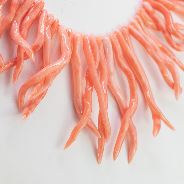 Astonishing and lovely vintage Art Deco era branch natural coral necklace with graduated pieces of natural salmon red coral branches tightly strung with golden silver. A fabulous Spring to Summer antique necklace that would make a great addition to