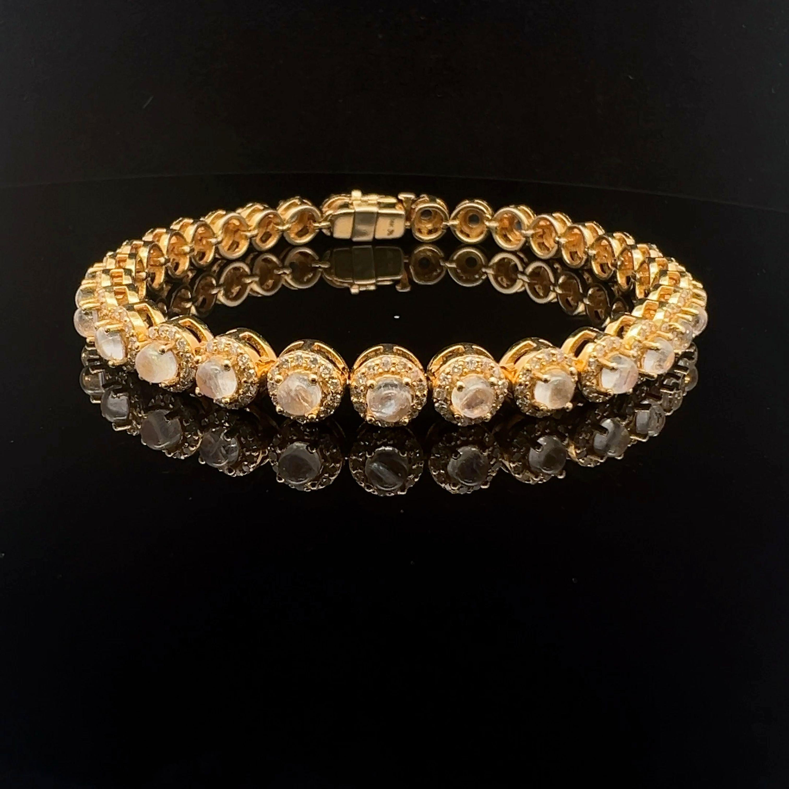 A stunning 14-karat yellow gold bracelet set with 1.7-carat diamonds and a 4.30-carat natural round moonstone. 
Carry this natural moonstone bracelet, which has a single row of moonstone beautifully surrounded by diamonds, time to adorn your wrist