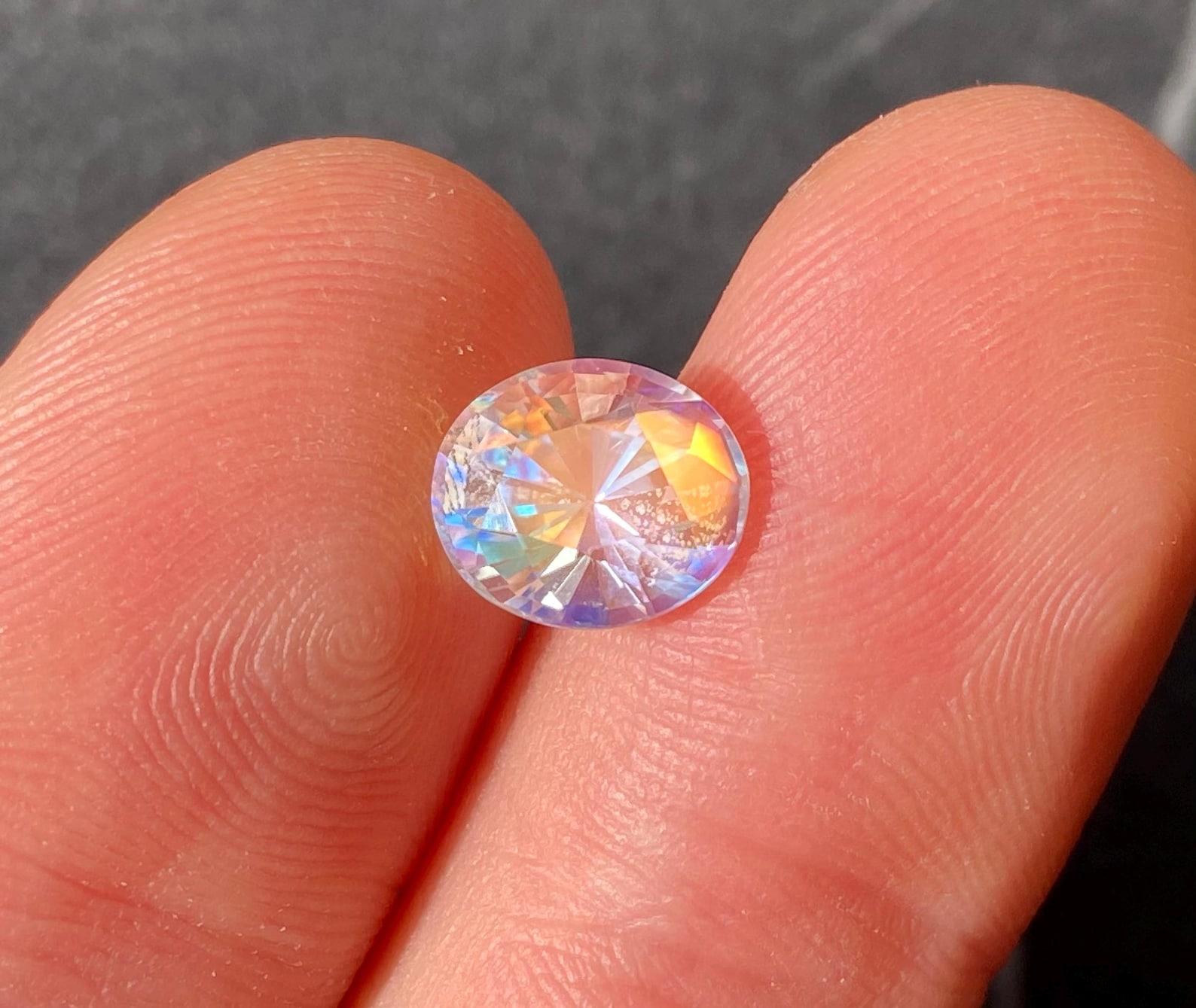 Natural Rainbow Moonstone Loose gemstone
Warning Video and photo made on sunlight!!!

Laboratory GFCO certified
Gemstone Color: White with Multicolor Sheen
Gemstone Type: Rainbow Moonstone
Gemstone size: 9.76x8.33x7.11 mm
Cut Grade: