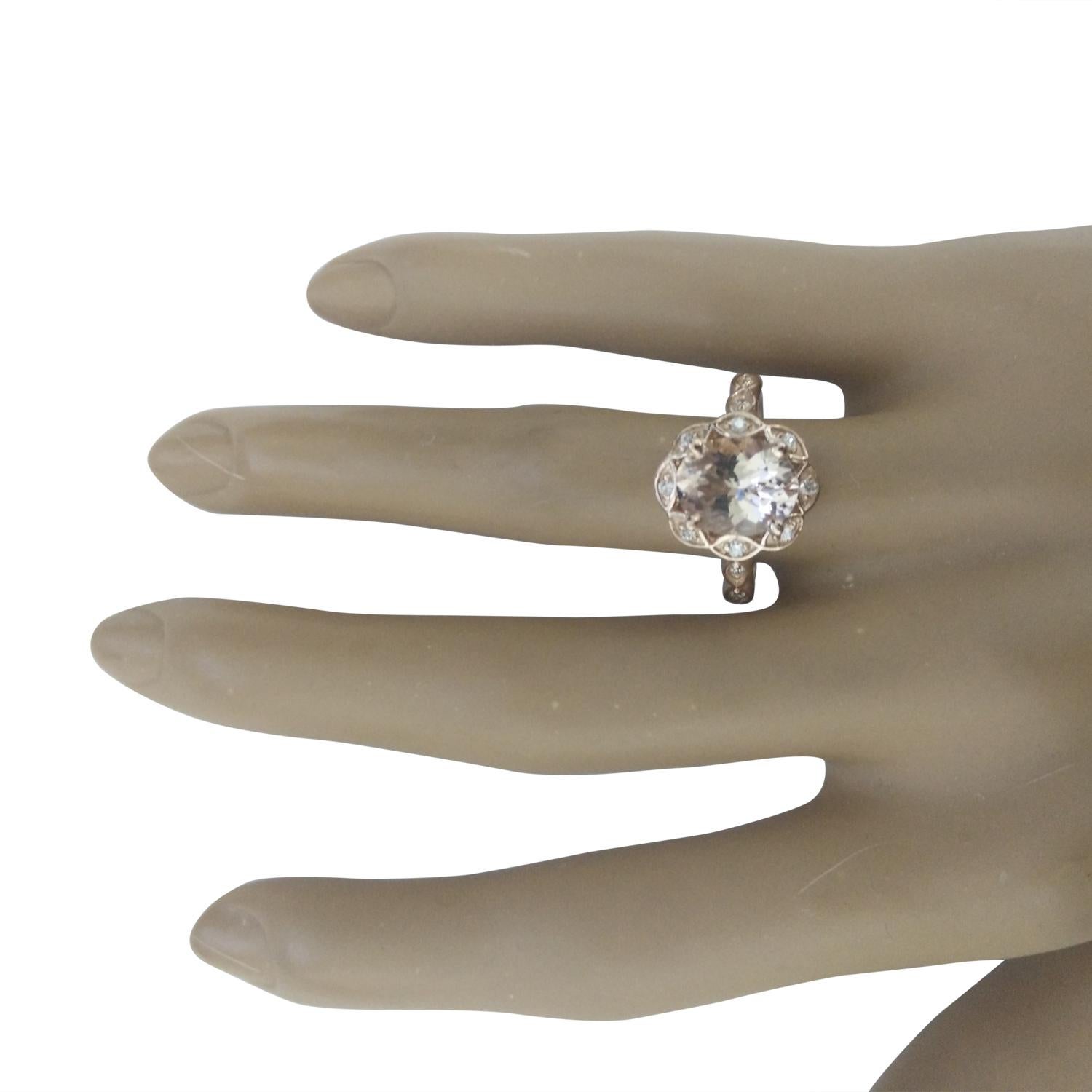 2.77 Carat Natural Morganite 14 Karat Solid Rose Gold Diamond Ring
Stamped: 14K
Total Ring Weight: 4.8 Grams 
Morganite Weight: 2.52 Carat (10.00x8.00 Millimeters)  
Diamond Weight: 0.25 Carat (F-G Color, VS2-SI1 Clarity)
Quantity: 12
Face Measures: