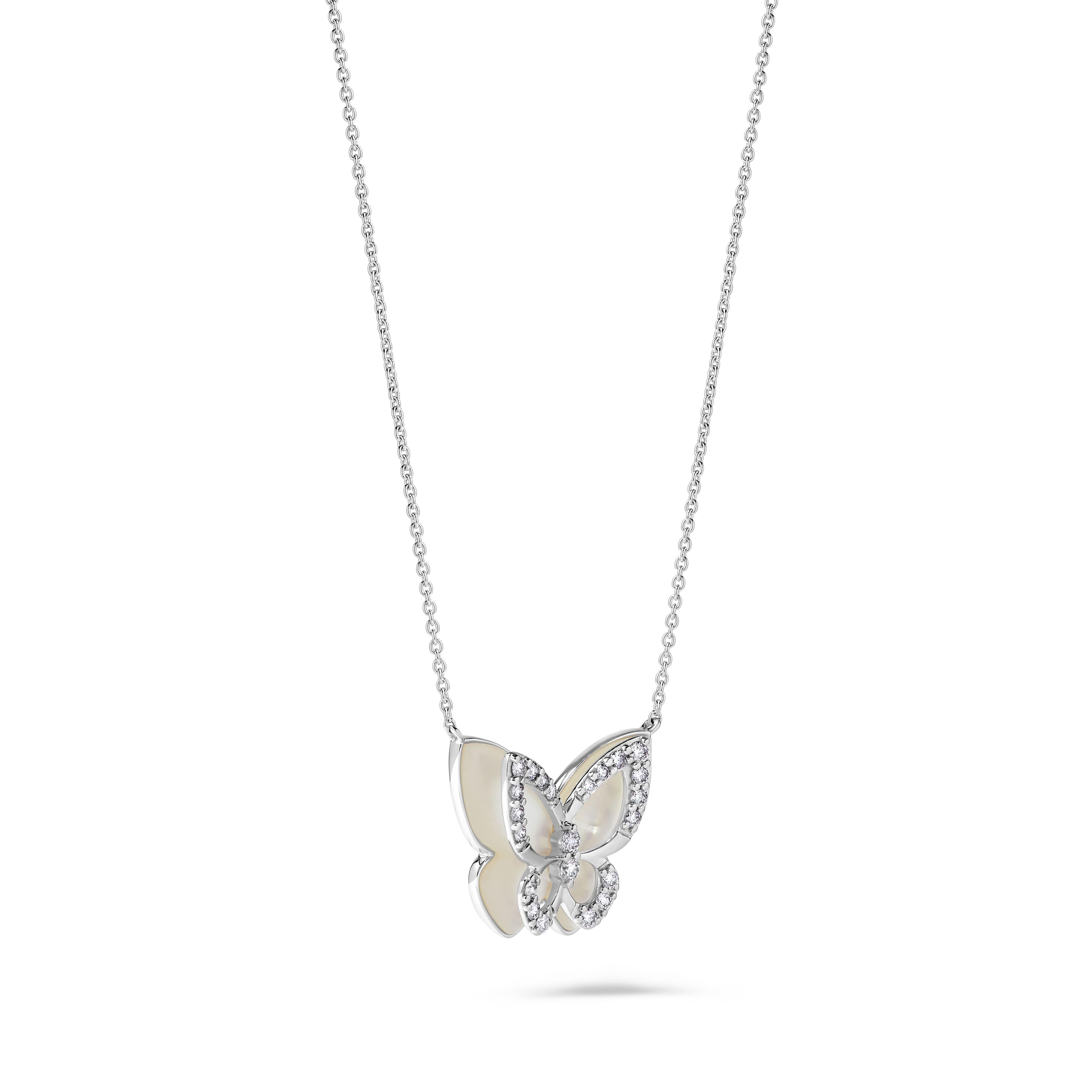 RareGemWorld's beautiful butterfly necklace. Mounted in a beautiful 18K White Gold setting with a distorted butterfly shape natural mother of pearl complimented by natural round white diamond melee. This pendant is guaranteed to impress and enhance
