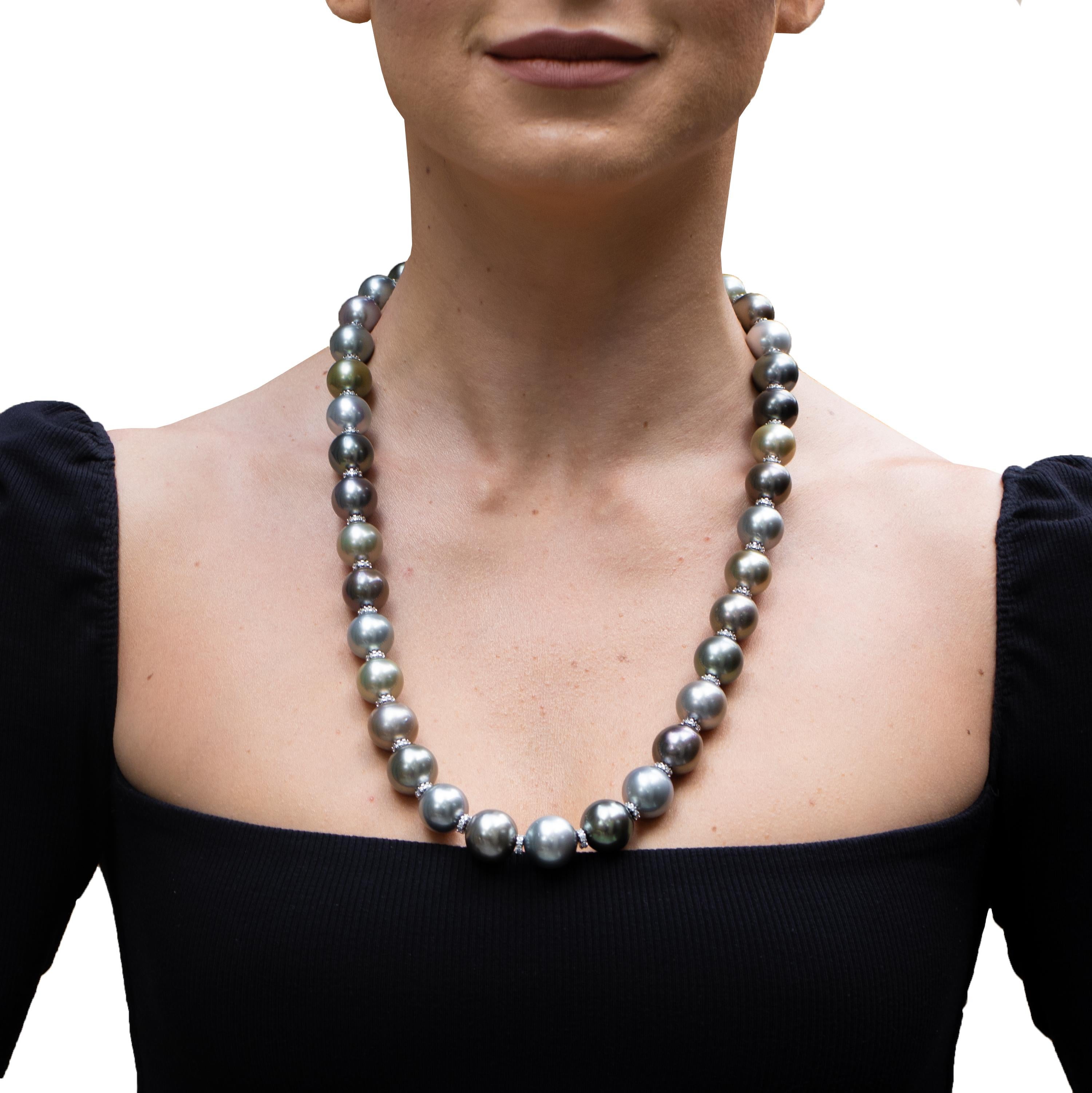 Very Fine Large Tahitian Pearls ranging from 13mm - 17mm with beautiful diamond rondelles. For that person who loves compliments and power, this necklace is perfect as it will bring both. 
Natural Multi-Color Tahitian Pearls
Length = 24