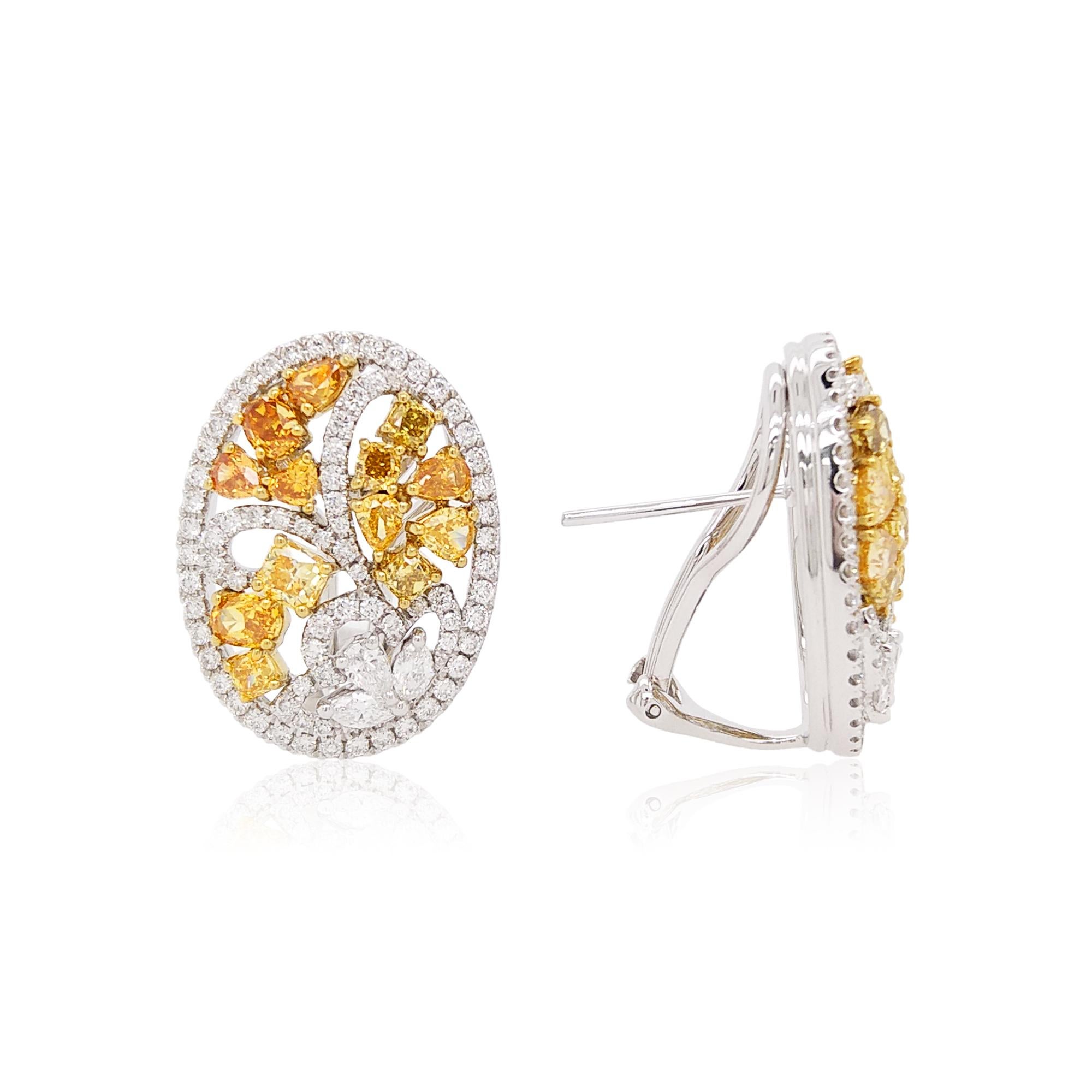 These elegant earrings are an ornate arrangement of Yellow and White Diamonds. Each of the diamonds has been hand-selected and expertly matched due to their superior lustre, colour, and shape, ensuring that each piece is truly spectacular. The rich