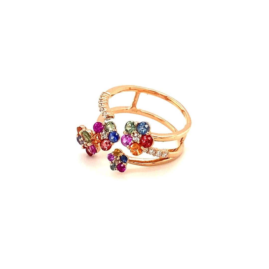 A Uniquely designed Multi Color Sapphire and Diamond Ring that is sure to be a great addition to your jewelry collection!  
This ring has 24 Natural Round Cut Multi Color Sapphires that weigh 1.52 carats which are accented by a row of 11 Round cut