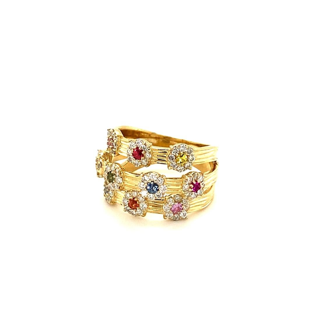 A uniquely designed Multi Color Sapphire and Diamond Ring that is sure to be a great addition to your jewelry collection!  
This ring has 10 Natural Round Cut Multi Color Sapphires that weigh 0.48 carats which are accented by 88 Natural Round Cut